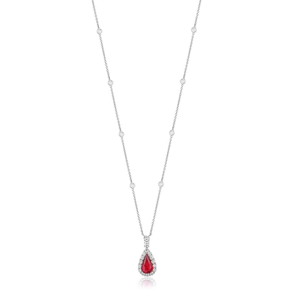 A platinum pendant centered upon an exceptional 4.03 carat pear-shaped natural unheated Mozambique ruby, certified as 
