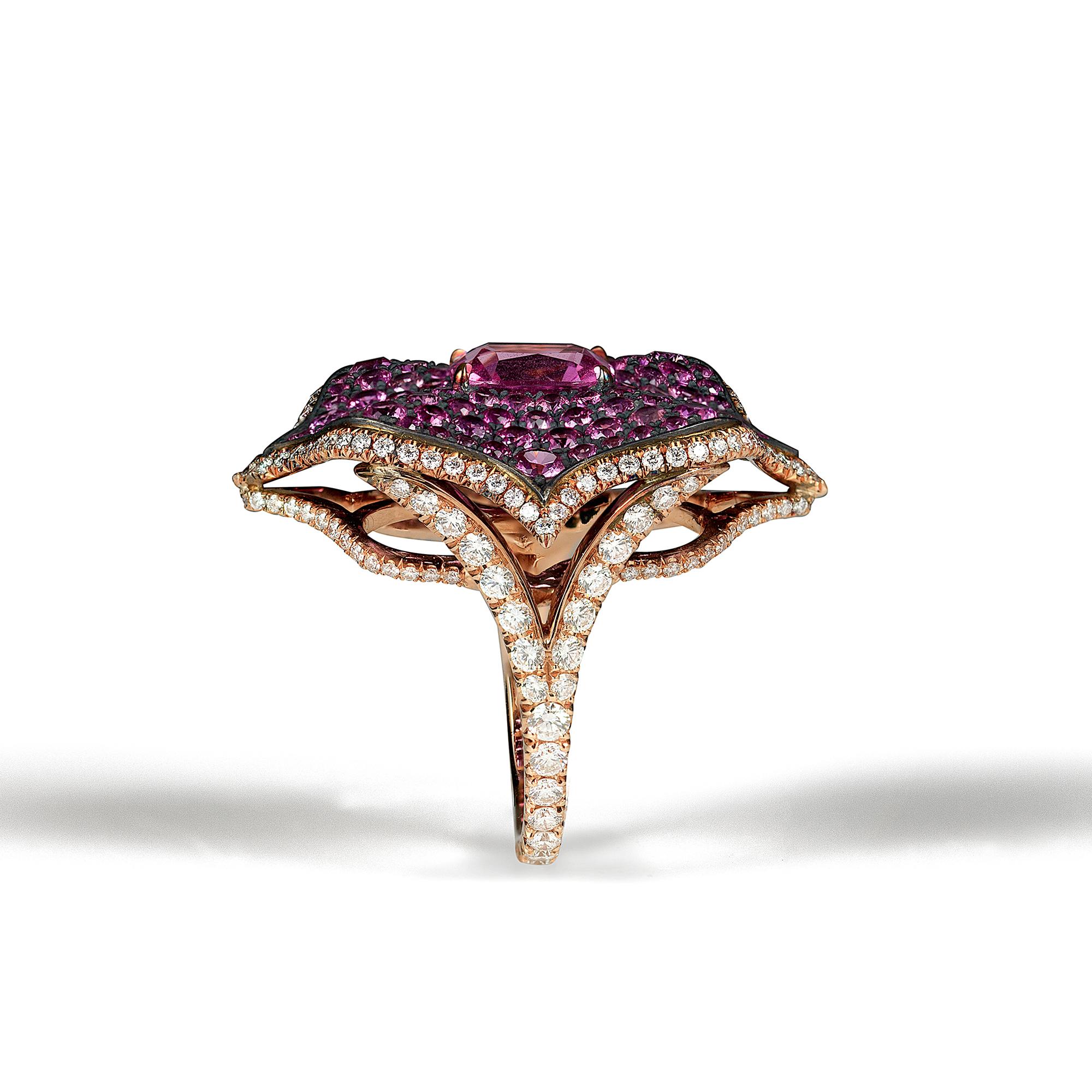 A beautiful Lotus ring centered upon a 2.21 carat cushion pink sapphire, certified by C. Dunaigre, set atop a bed of pink sapphire pavé, weighing 3.48 carats total, set in oxidized silver which is surrounded by an 18k rose gold frame set in diamond