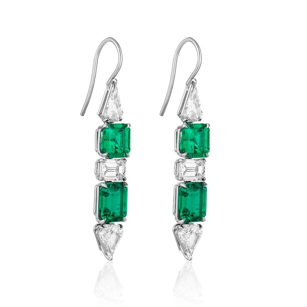 A pair of platinum ear pendants set with 4 emerald-cut Colombian emeralds weighing 5.56 carats total, certified by Gubelin Gem Lab and C.Dunaigre Consulting, alternating with 6 white diamonds weighing 2.91 carats total, all suspended from a delicate