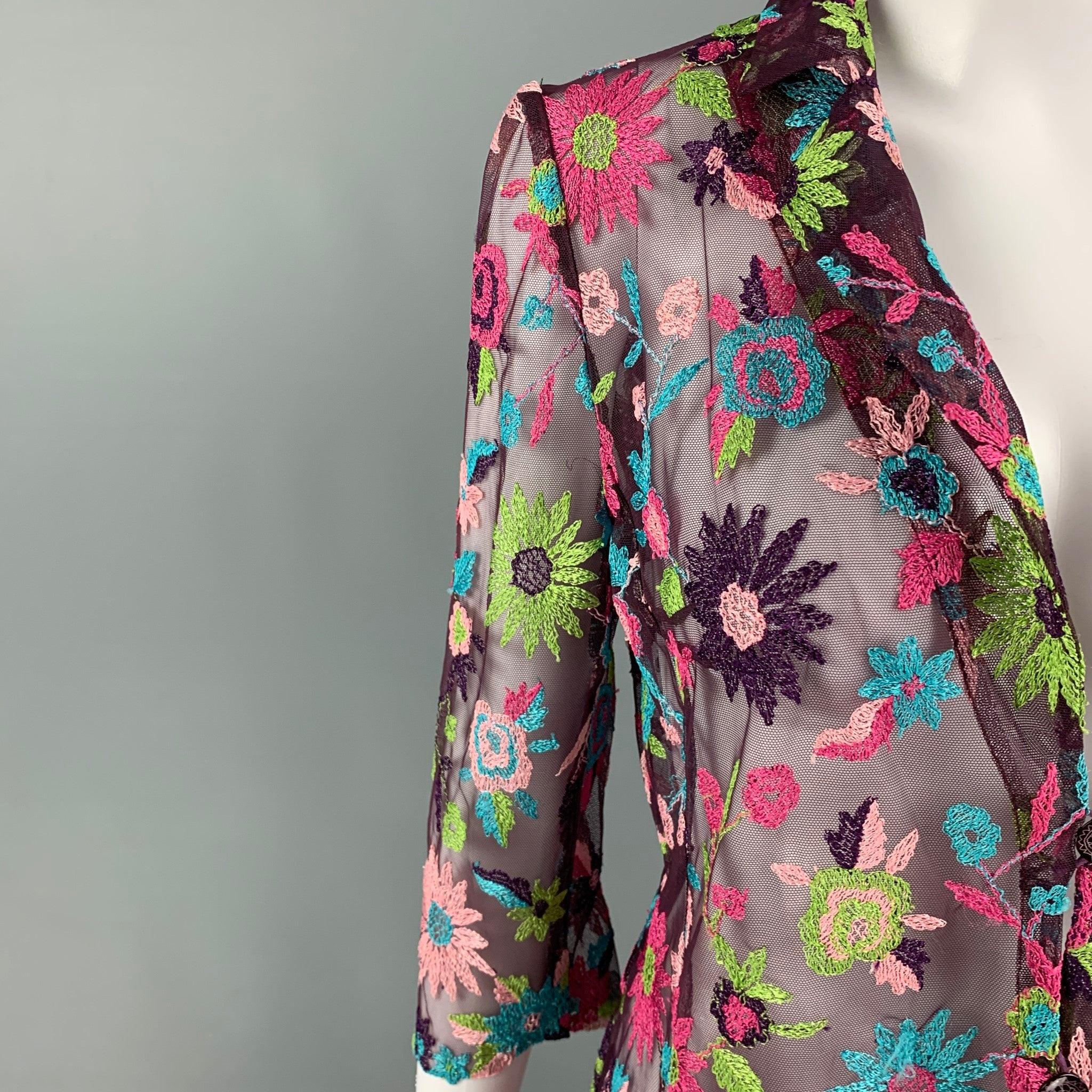 BAZAR by CHRISTIAN LACROIX top comes in a purple & multi-color see through rayon blend featuring floral embroidered designs throughout, notch lapel, and a buttoned closure. Made in France.Very Good
Pre-Owned Condition. 

Marked:   38 

Measurements: