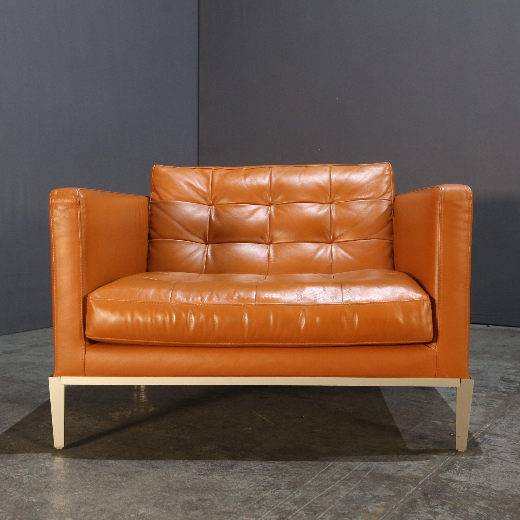 Introducing the stunning AC Lounge Armchair by renowned designer Antonio Citterio for B&B Italia. This luxurious armchair is the epitome of style and comfort, featuring a sleek and modern design that will elevate any living space. Crafted with the