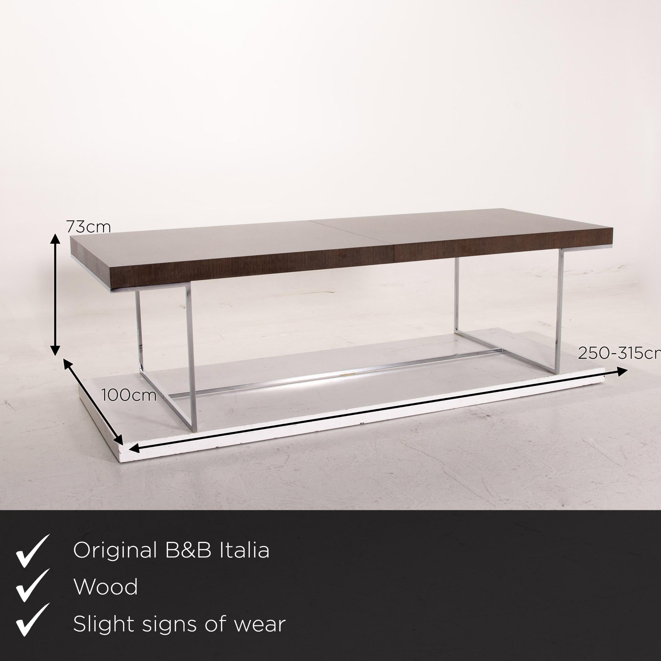 We present to you a B&B Italia Athos 12 wood metal dining table extendable.


 Product measurements in centimeters:
 

Depth 100
 Width 250
 Height 73.





 