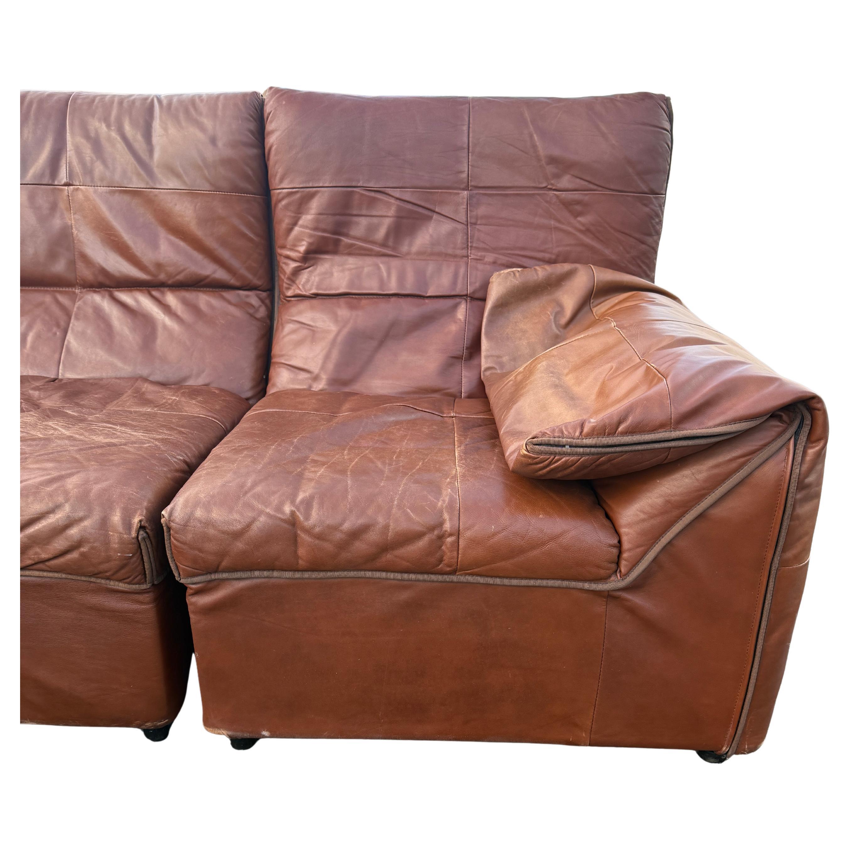 Rare B&B Italia Baia Leather Sectional Sofa by Antonio Citterio & Paolo Nava, 1970.

Brown leather upholstery over plastic steel and  foam frame modular sectional sofa. Leather shows wear fading and patina otherwise a great modern designed sofa