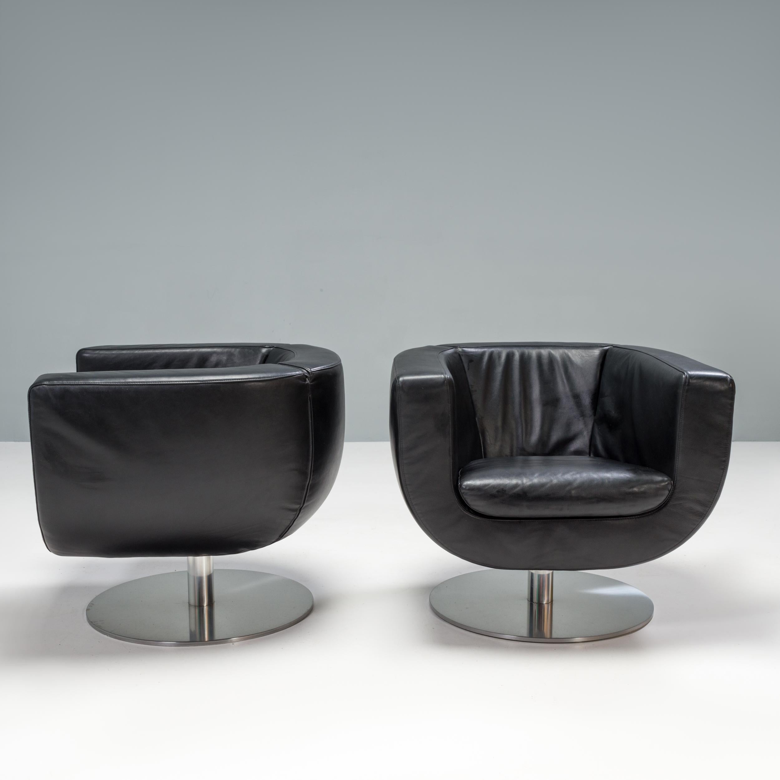 Designed by Jeffrey Bernett for B&B Italia in 2000, the Tulip armchair balances soft curves with sleek straight lines to create a timeless design.

Constructed with a tubular steel frame, the armchairs swivel 360 degrees on the brushed aluminium