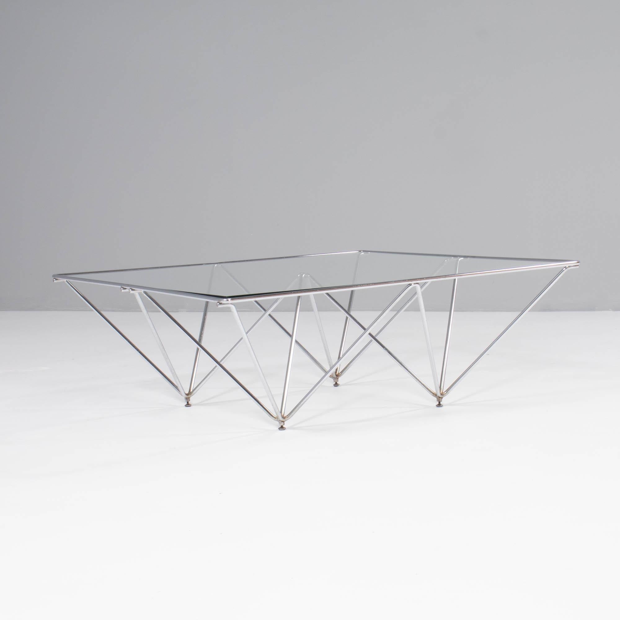 Originally designed by Paolo Piva for B&B Italia in the 1980s, the Alanda coffee table is a design classic which perfectly showcases Piva’s architectural style.

The chromed steel base is made up of a geodetic frame, creating an upturned pyramid