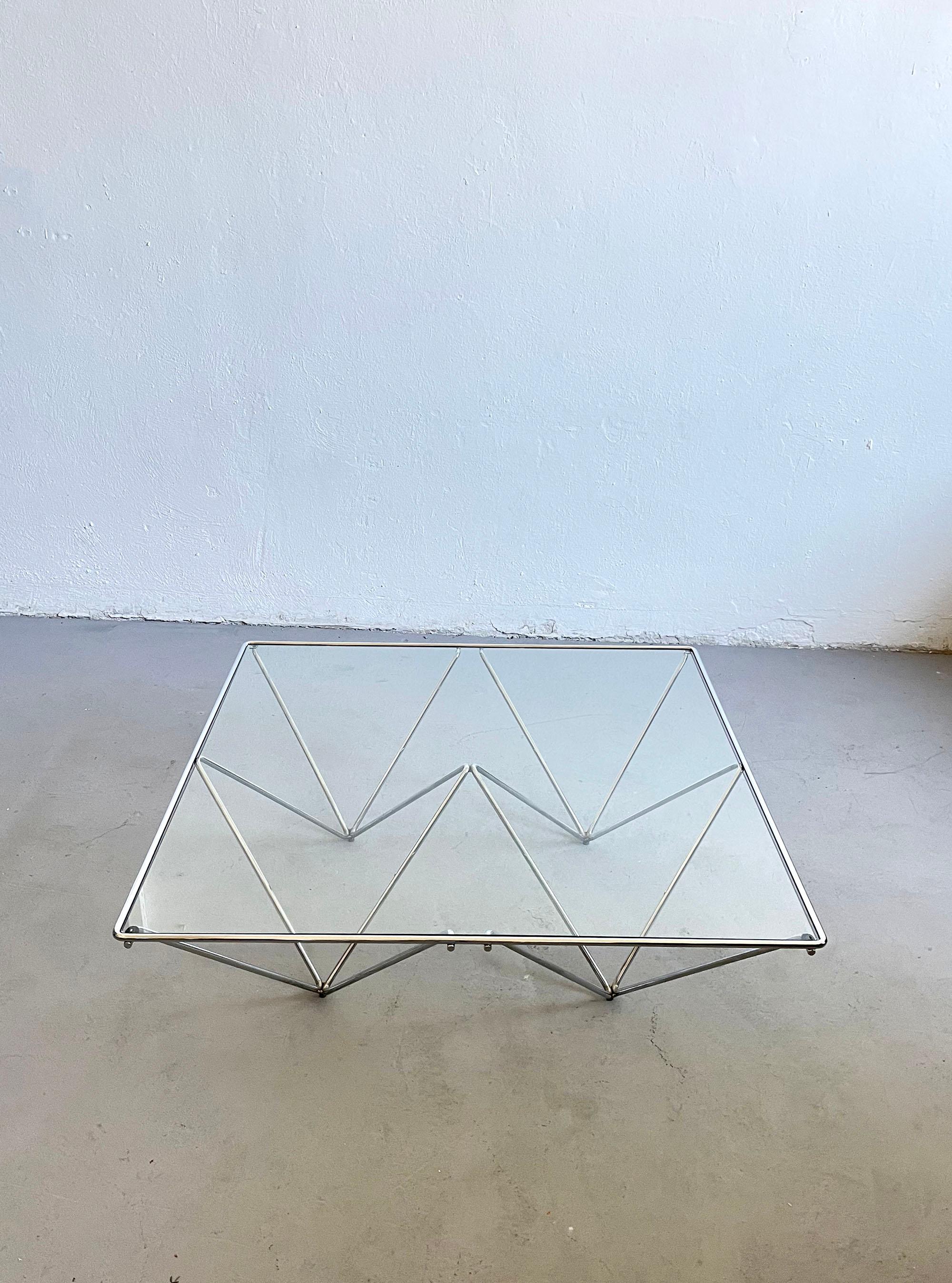 Alanda coffee table is a true design classic of the 20th century. 
Originally it was designed by Paolo Piva for B&B Italia in the 1980s.

The minimalist architectural form of the table is simple, geometrical and very elegant. 
The chromed steel
