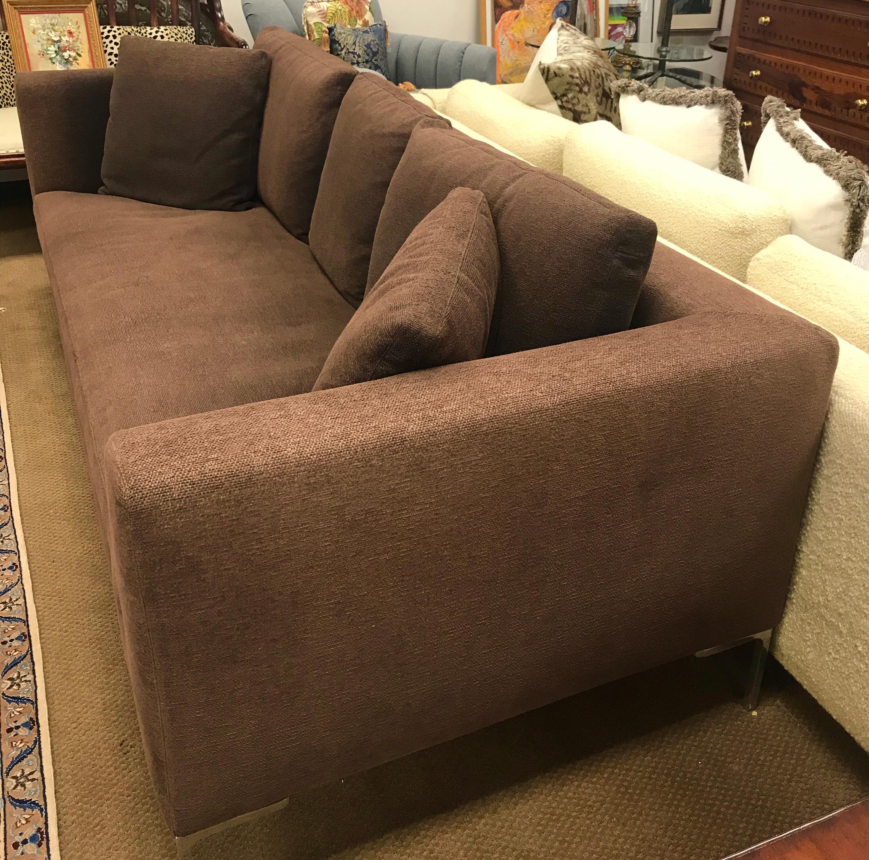 Coveted ninety inch Charles sofa by B&B Italia comes with all paperwork still in folder with piece.
One of B&B Italia's most sought after sofas, it was designed by world renowned designer Antoni Citterio.
The upholstery is a thick brown weave and
