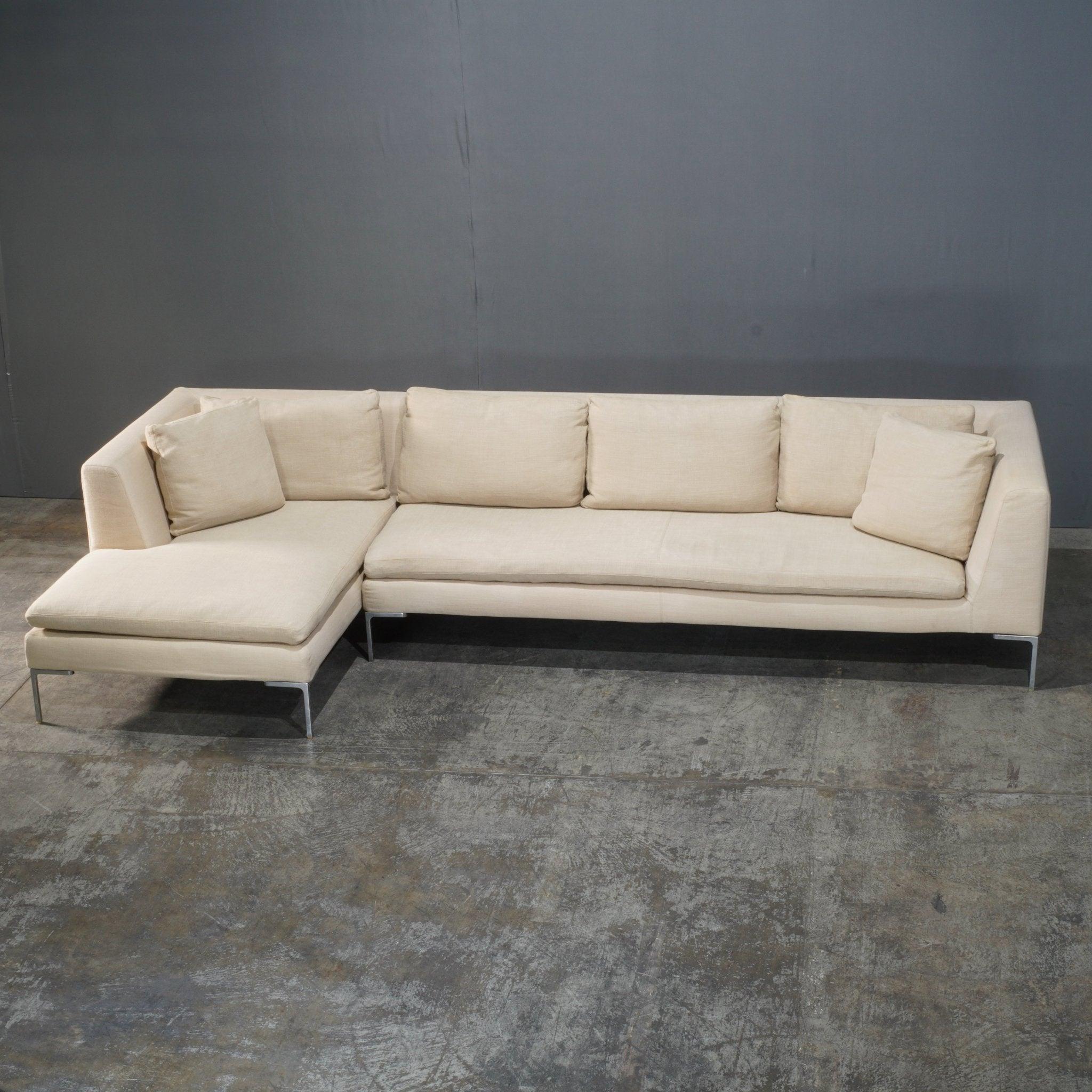 The B&B Italia Charles Corner Sofa by Antonio Citterio is a timeless piece that exudes modern sophistication. Defined by its sleek, linear design and raised frame on slim aluminium legs, the Charles sofa offers both style and comfort. The ample