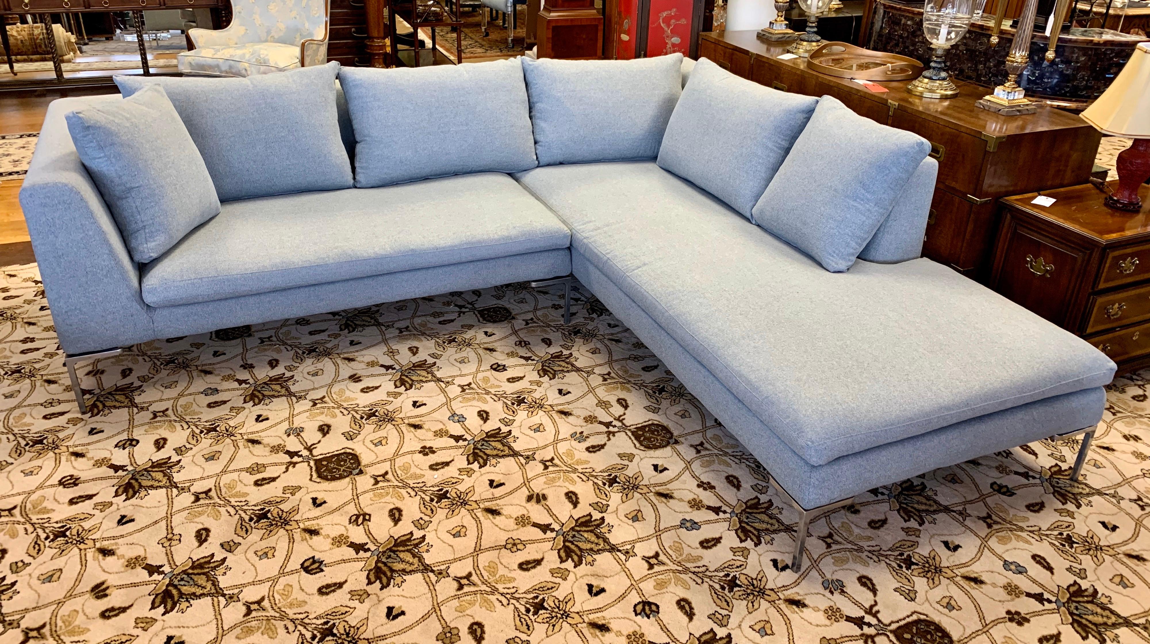 Elegant, signed B&B Italia sectional sofa with brand new upholstery done is a light gray tone with a hint of blue undertone. This is the coveted Charles style sectional sofa designed by Antonio Citterio for B&B Italia. It is famous for its airy and