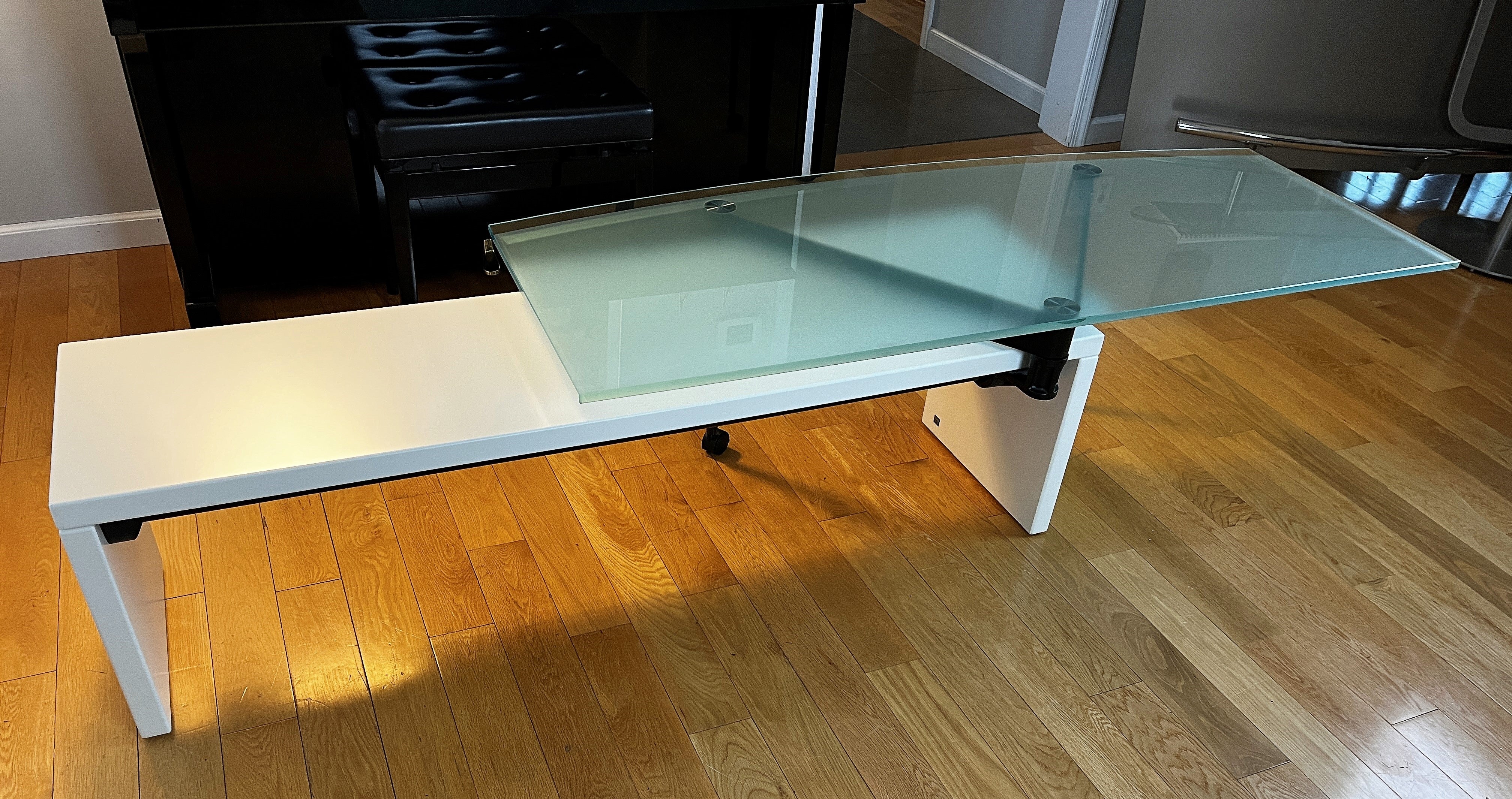 B&B Italia coffee table - 360 degree rotating blue glass top over white lacquer base. A one of a kind coffee table. Glass is half inch thick.
