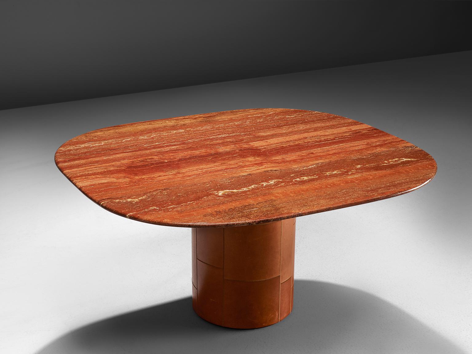B&B Italia, dining table in red travertine and leather, Italy, 1970s.

Centre table with leather base and top of red travertine. The combination of material, leather and travertine, from a strong contrast. The red to orange colored travertine