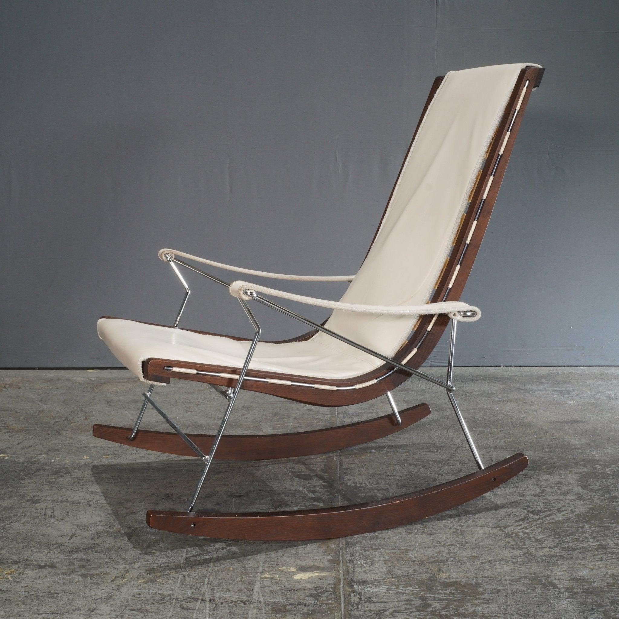 Immerse yourself in unparalleled comfort and style with the J.J. Rocking Chair by Antonio Citterio for B&B Italia. This exquisite piece seamlessly blends modern design with timeless Italian craftsmanship. The chair's structure is formed from a sleek