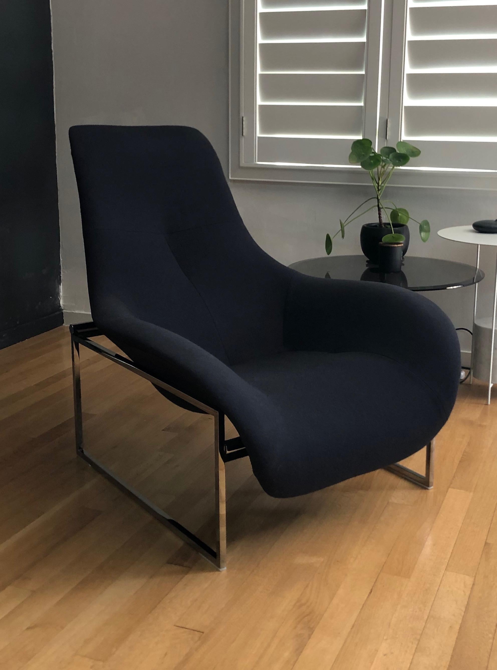 Beautifully sleek and sculptural B&B Italia adjustable lounge by Antonio Citterio. Covered in charcoal wool hopsack fabric with polished chrome base. Has two seating positions: upright and reclining. Extremely comfortable and minimal design.