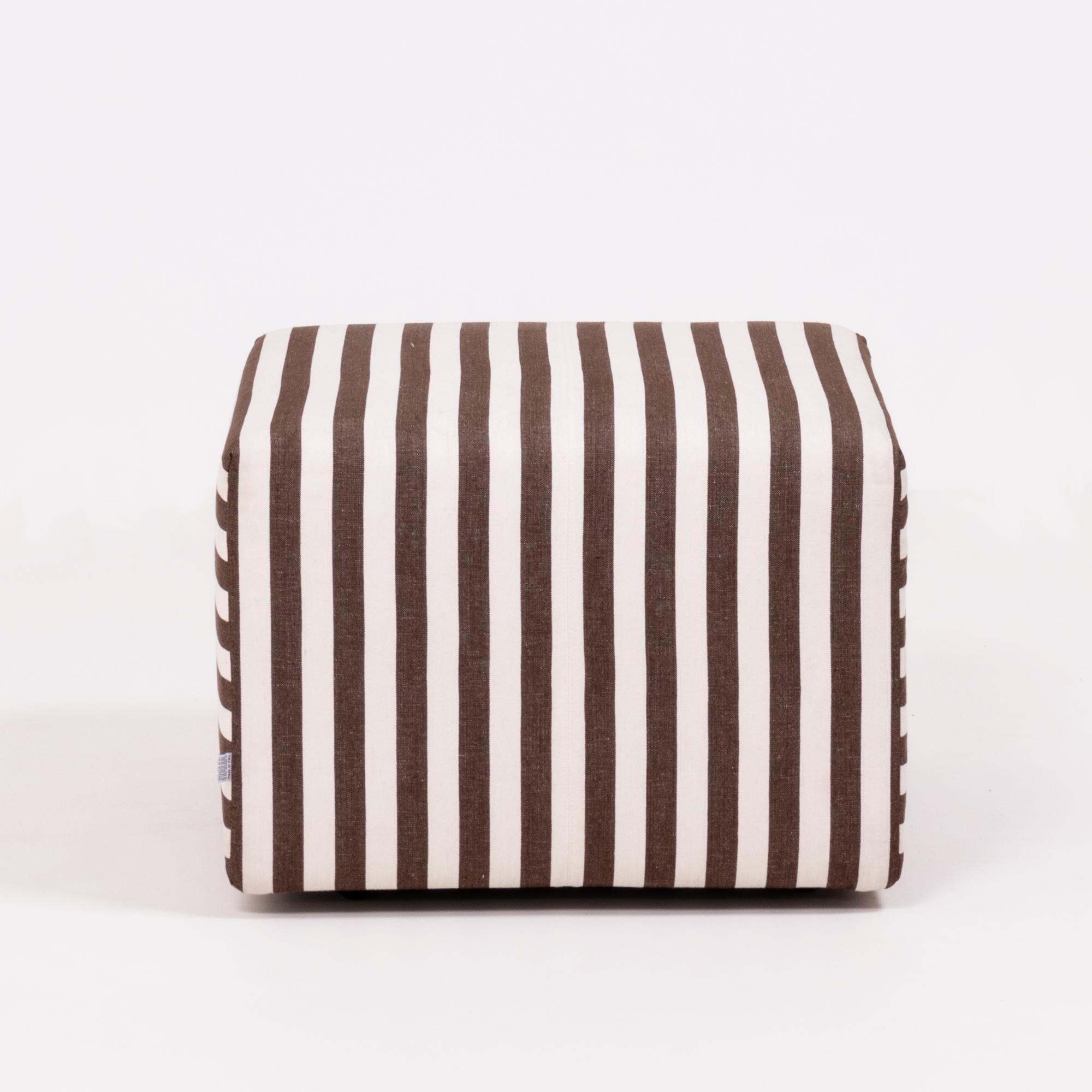 Originally designed in 2003 by Antonio Citterio for B&B Italia, the P60 ottoman is simple yet bold.

Featuring a cubed shape, the ottoman is upholstered in graphic brown and ivory striped fabric which can be removed with velcro on the underside,