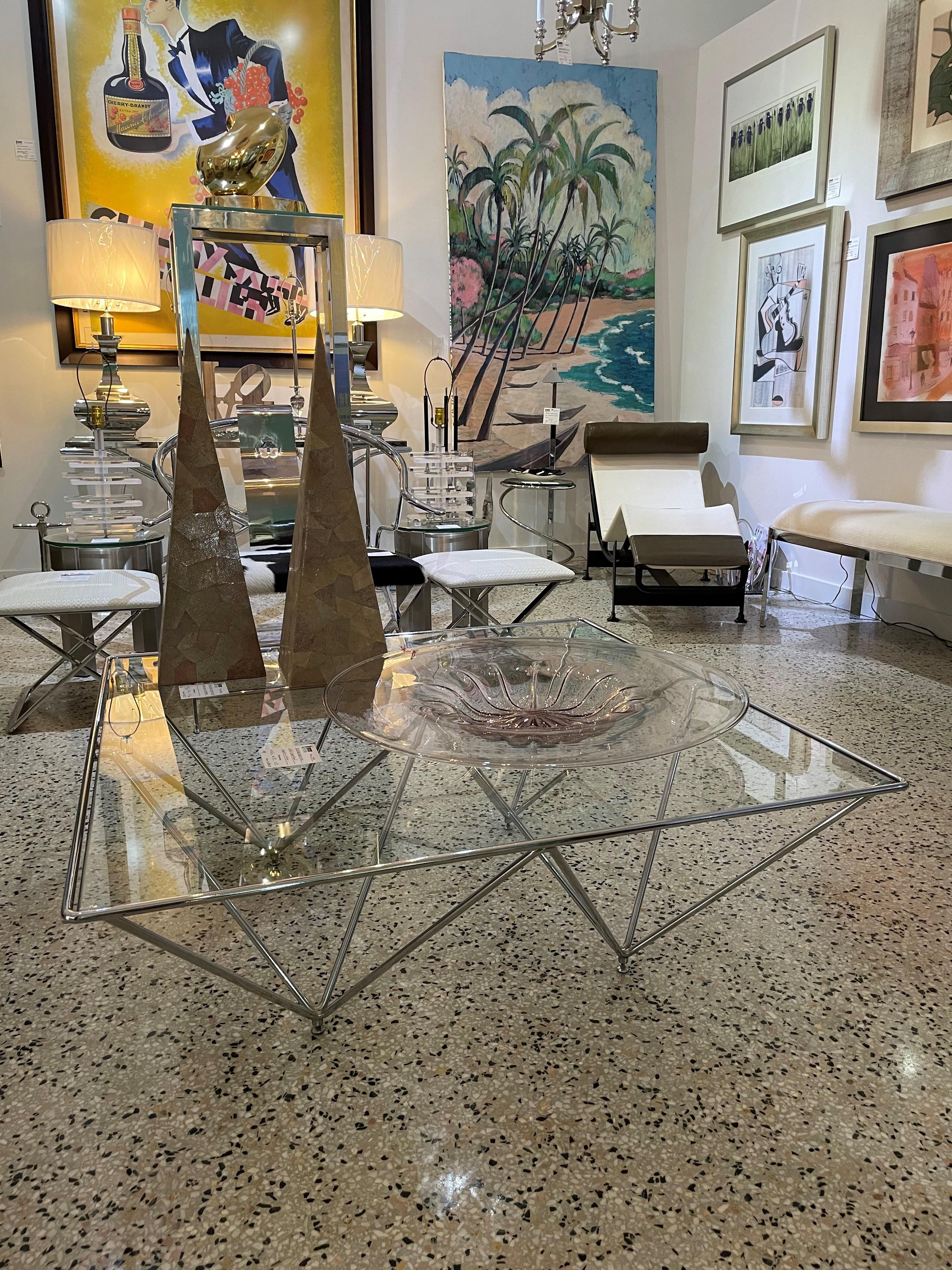 This stylish, chic and classic Post Modern cocktail table dates to the 1980s and the design was created by Paulo Piva, for B&B Italia, and is known as the Alanda. 

Note:  We have had the glass top replaced, and the glass is tempered. 