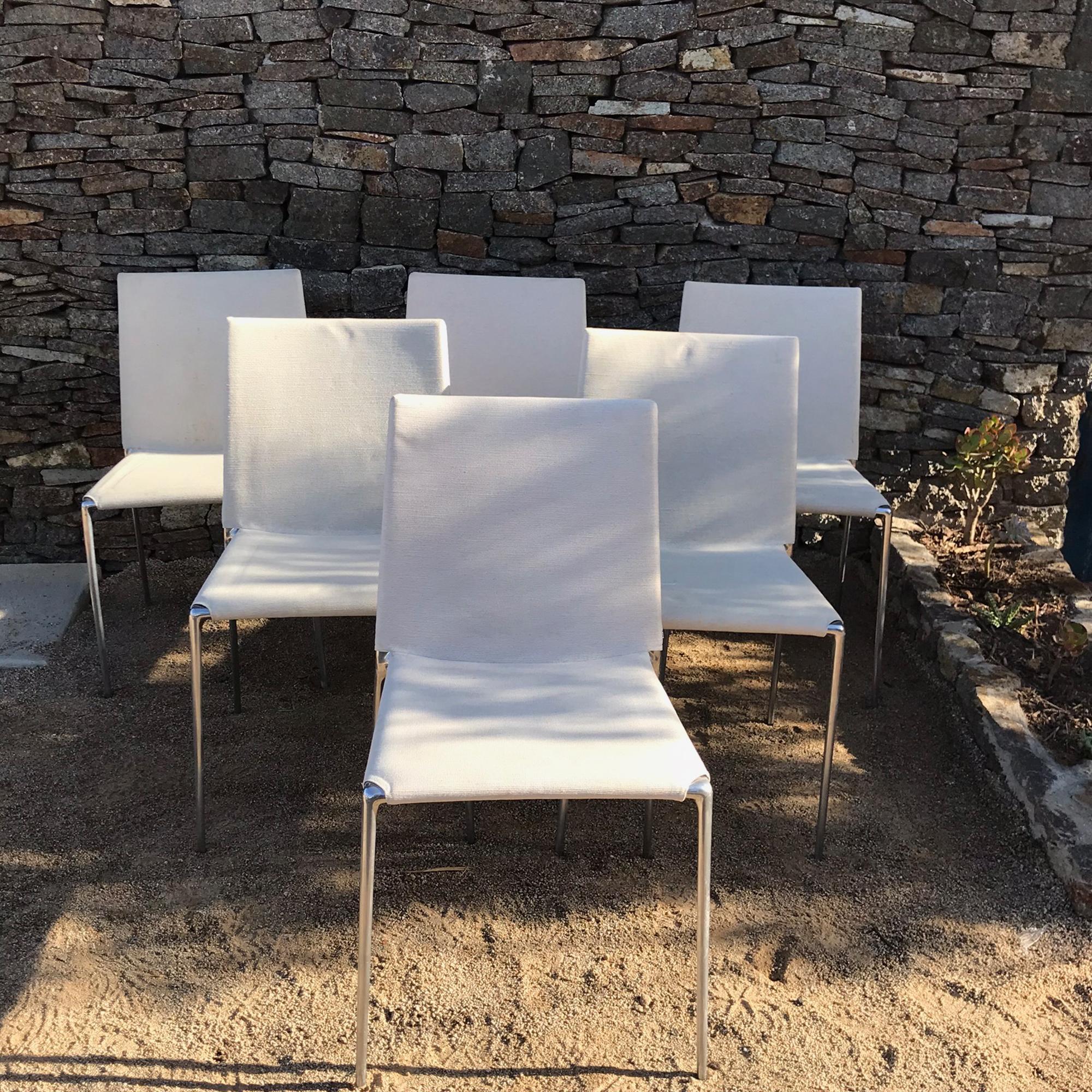 B&B Italia stacking set of six simply modern ALMA dining chairs in white with chrome designed by Roberto Barbieri for B&B Italia.
Made and stamped in Italy. Fabulous feature of being stackable. Modern flexibility.
Dimensions: 32