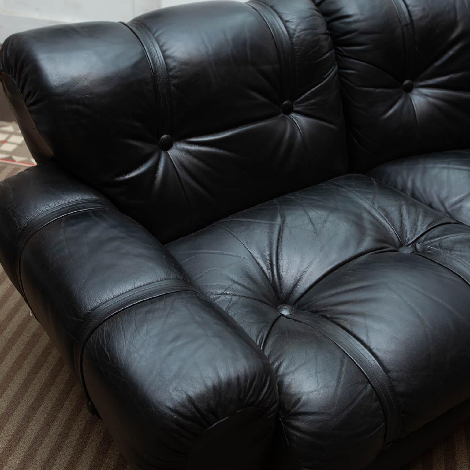 This four-seat leather sectional is a cross between Brazilian modern and B&B Italia via Tobia Scarpa. Most likely from the 1970s. Thick black leather is in great condition. Center section is 65