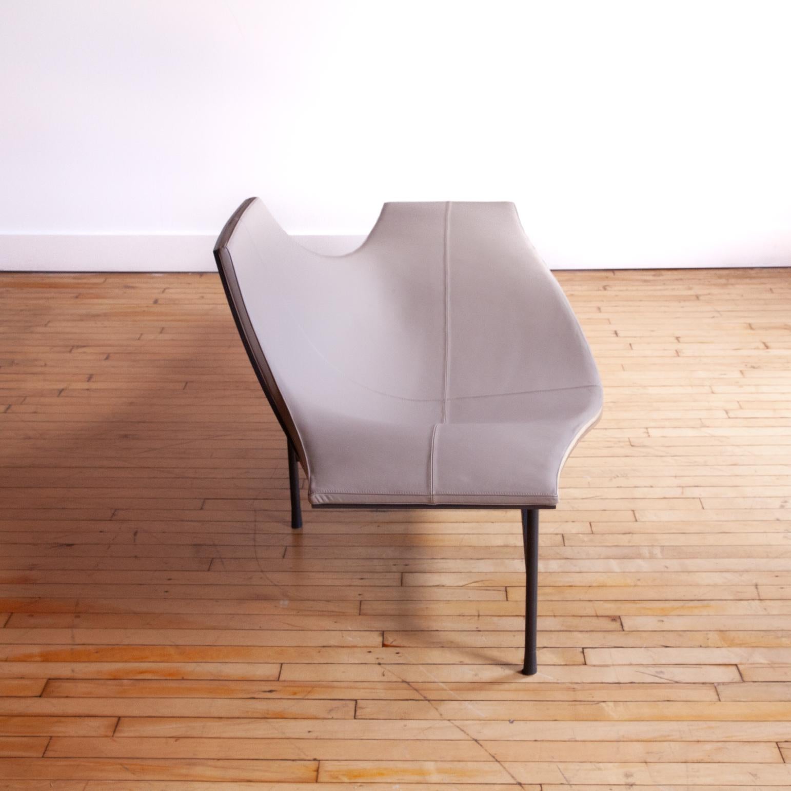 Absolutely outstanding contemporary design by Jean-Marie Massaud. High gloss lacquered shell combined with high quality grey leather and supported by a steel frame.

Can be used as an armchair or chaise lounge.  Terminal 1 possesses the essential
