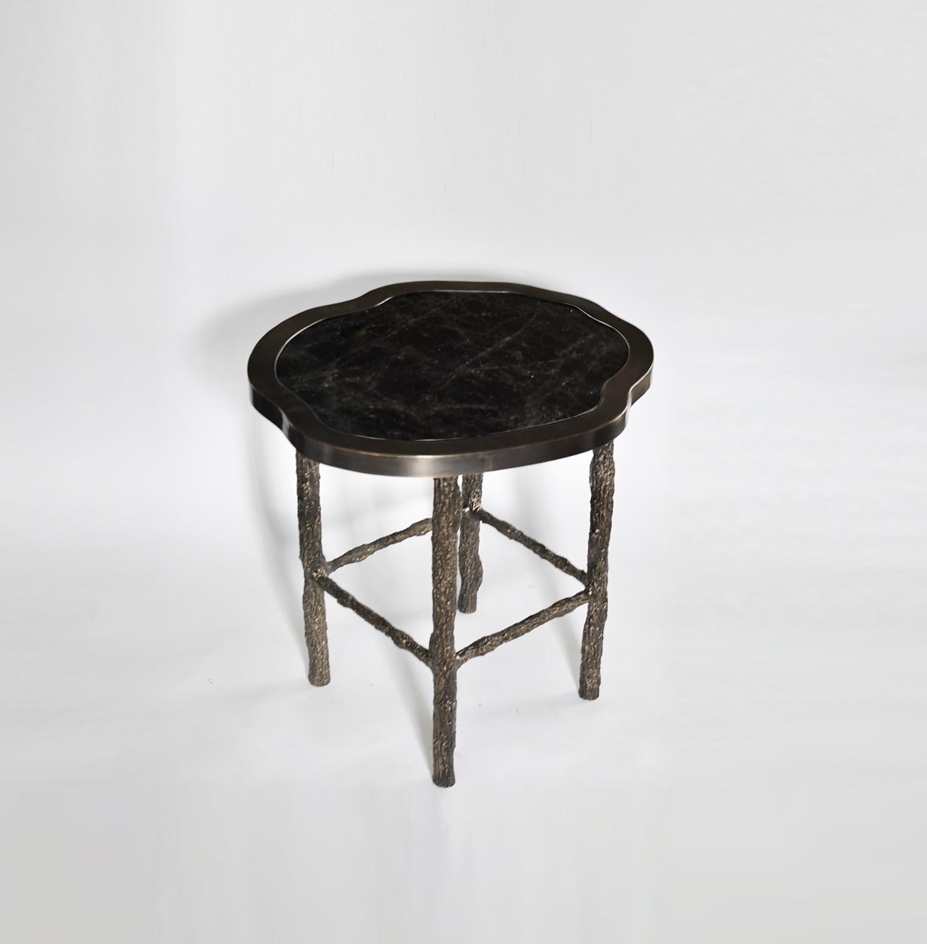 Organic form smoky rock crystal top side table with hammered antique brass frame. the twig inspired bronze legs
Create by Phoenix Gallery. 
Two in stock.
Custom size upon request.