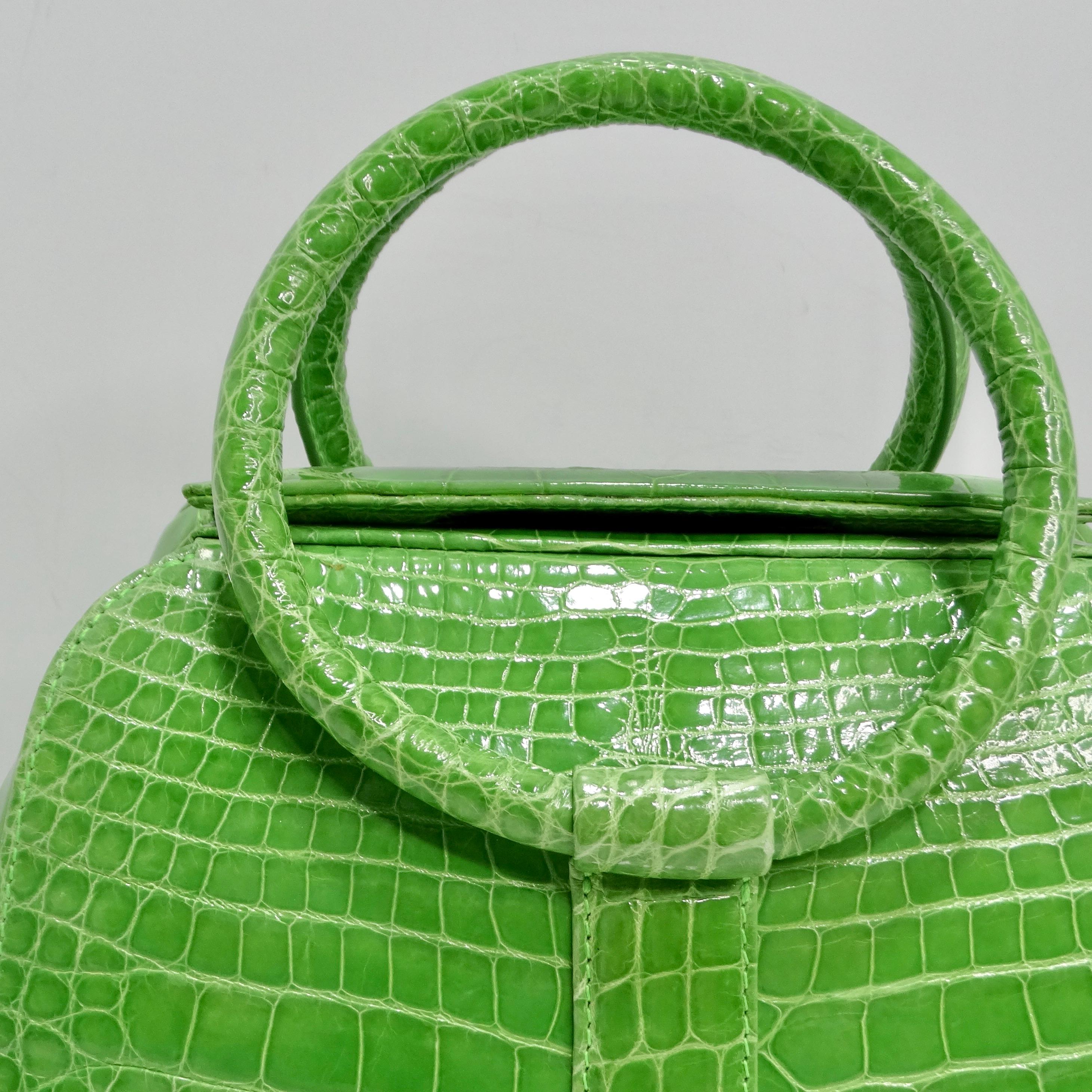 The BC Luxury Green Crocodile Leather Top Handle Bag is a truly exquisite accessory that exudes luxury and sophistication. Crafted from vibrant lime green crocodile leather, this structured top handle bag is sure to make a statement wherever you