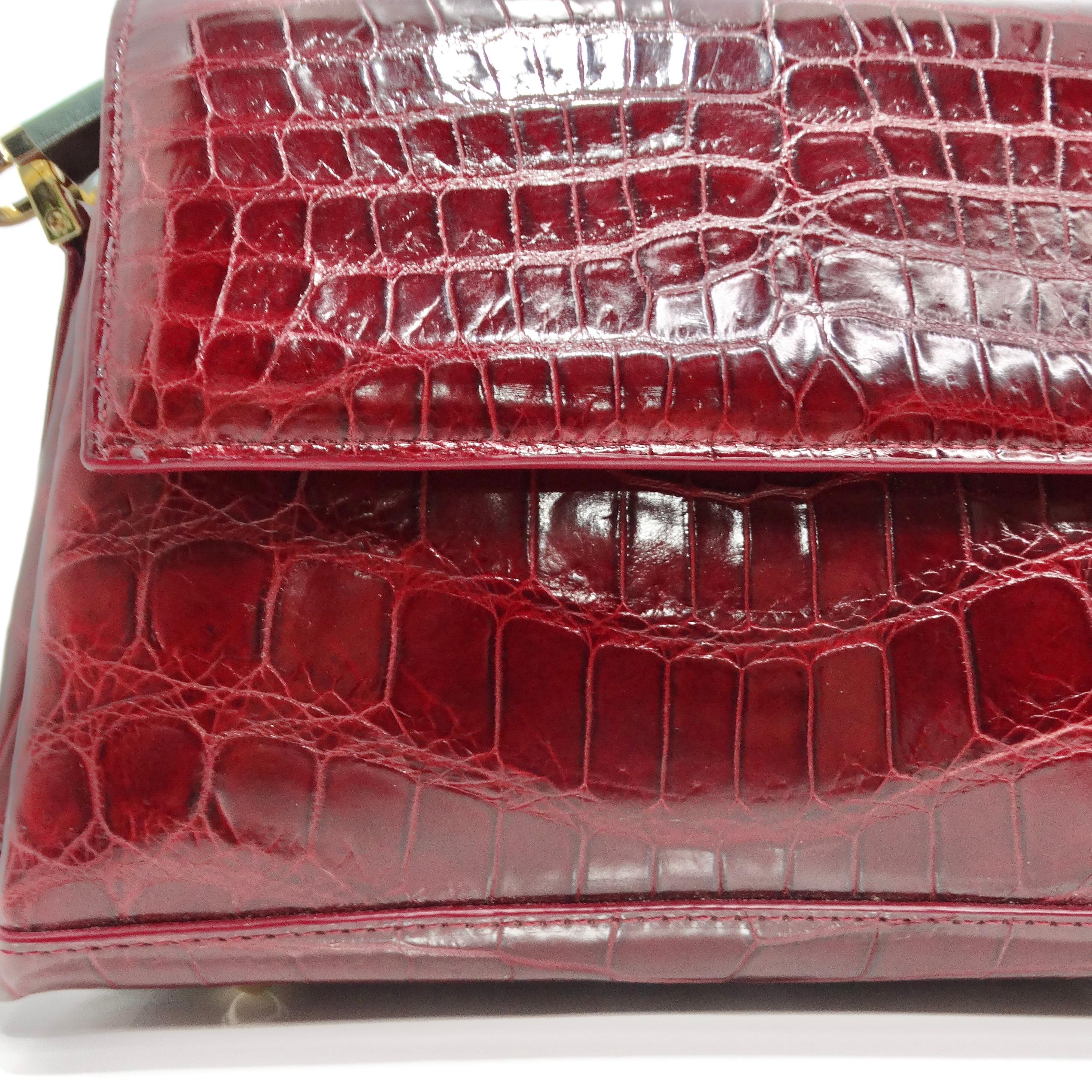 The BC Luxury Red Crocodile Leather Structured Handbag is a stunning accessory that exudes sophistication and elegance. Crafted from luxurious burgundy red crocodile leather, this structured mini handbag is sure to make a statement with its vibrant