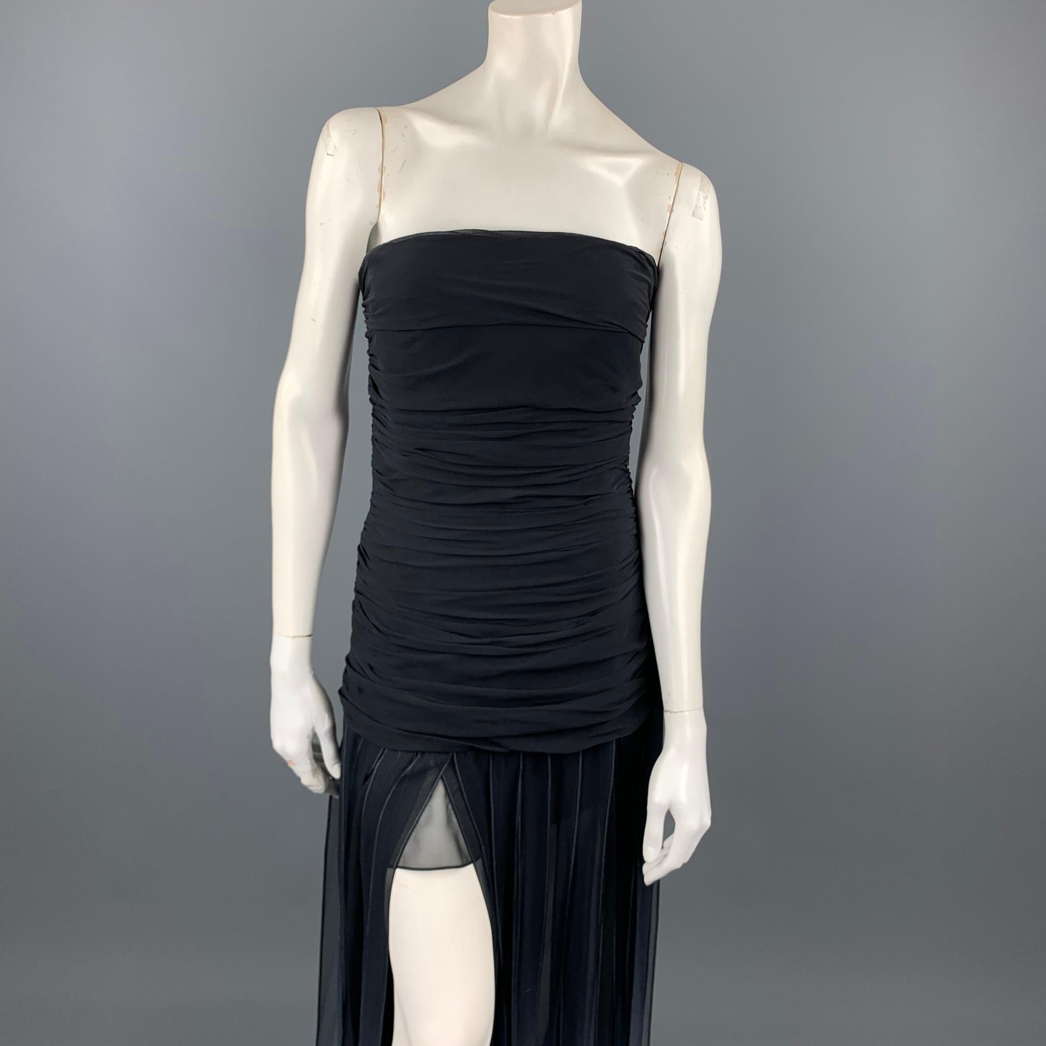 BCBGMAXAZRIA cocktail dress comes in a black ombre chiffon silk featuring a ruched bodice style, tiers skirt, strapless, and a back zip up closure.

Very Good Pre-Owned Condition.
Marked: 6

Measurements:

Bust: 26 in. 
Waist: 28 in.
Hip: 38 in.