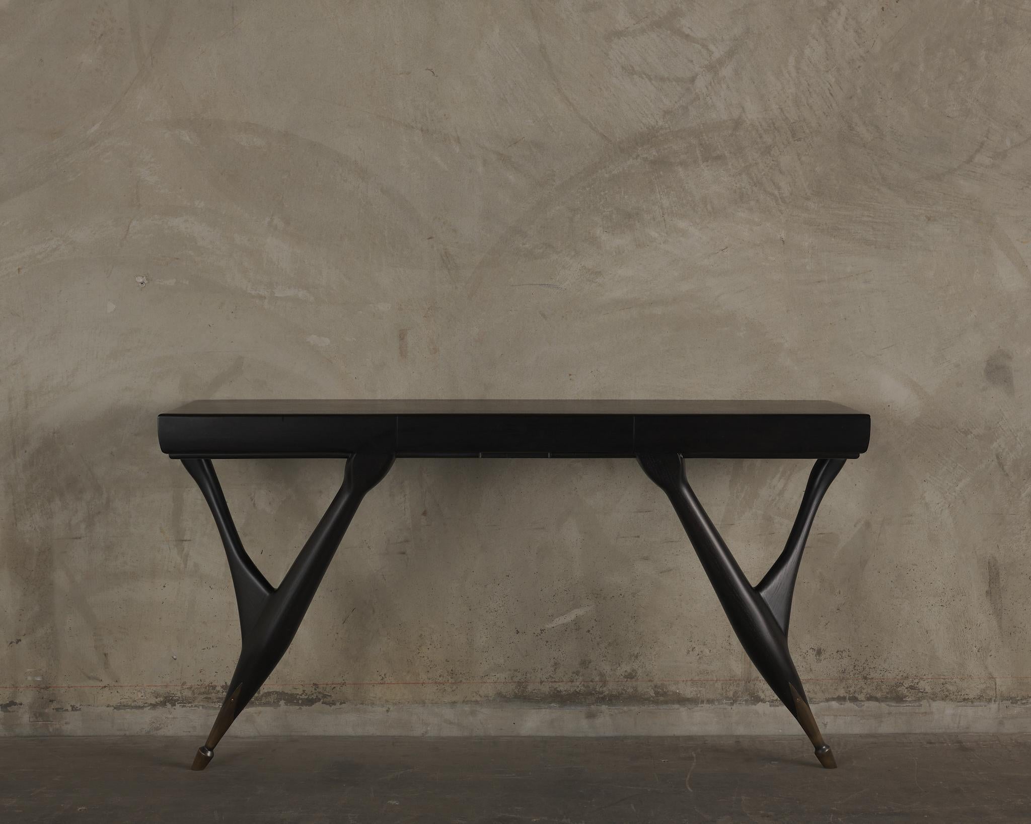 Embellish a room with this wood console that highlights strength in projection supports.