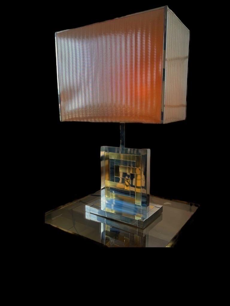An exceptional, exclusive Table Lamp from the 70s. This piece was made in the 1970s in Barcelona, by BD Lumica.

This piece is composed of golden brass, a chromed metal structure .

This Pieces of Arts glass show the exclusive design of Italian