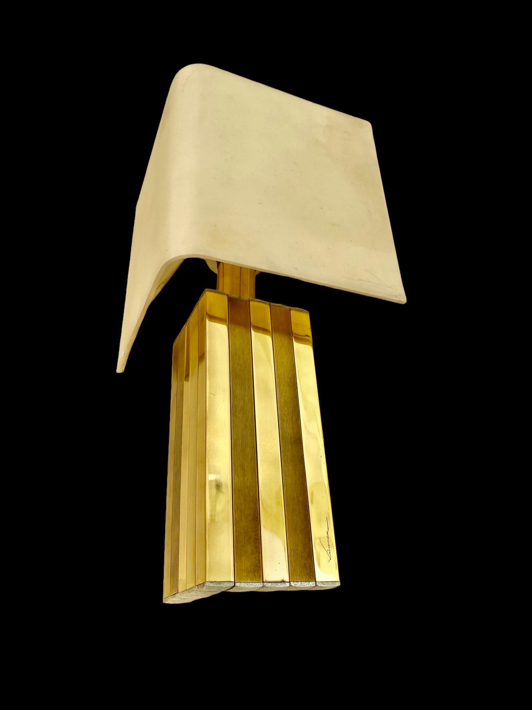 An exceptional, exclusive pair table lamp  or wall lighting from the 70s. This piece was made in the 1970s in Barcelona, ​​by BD Lumica.
This piece is composed of golden brass, a chromed metal structure .
This wall lamp is equipped with 1 socket