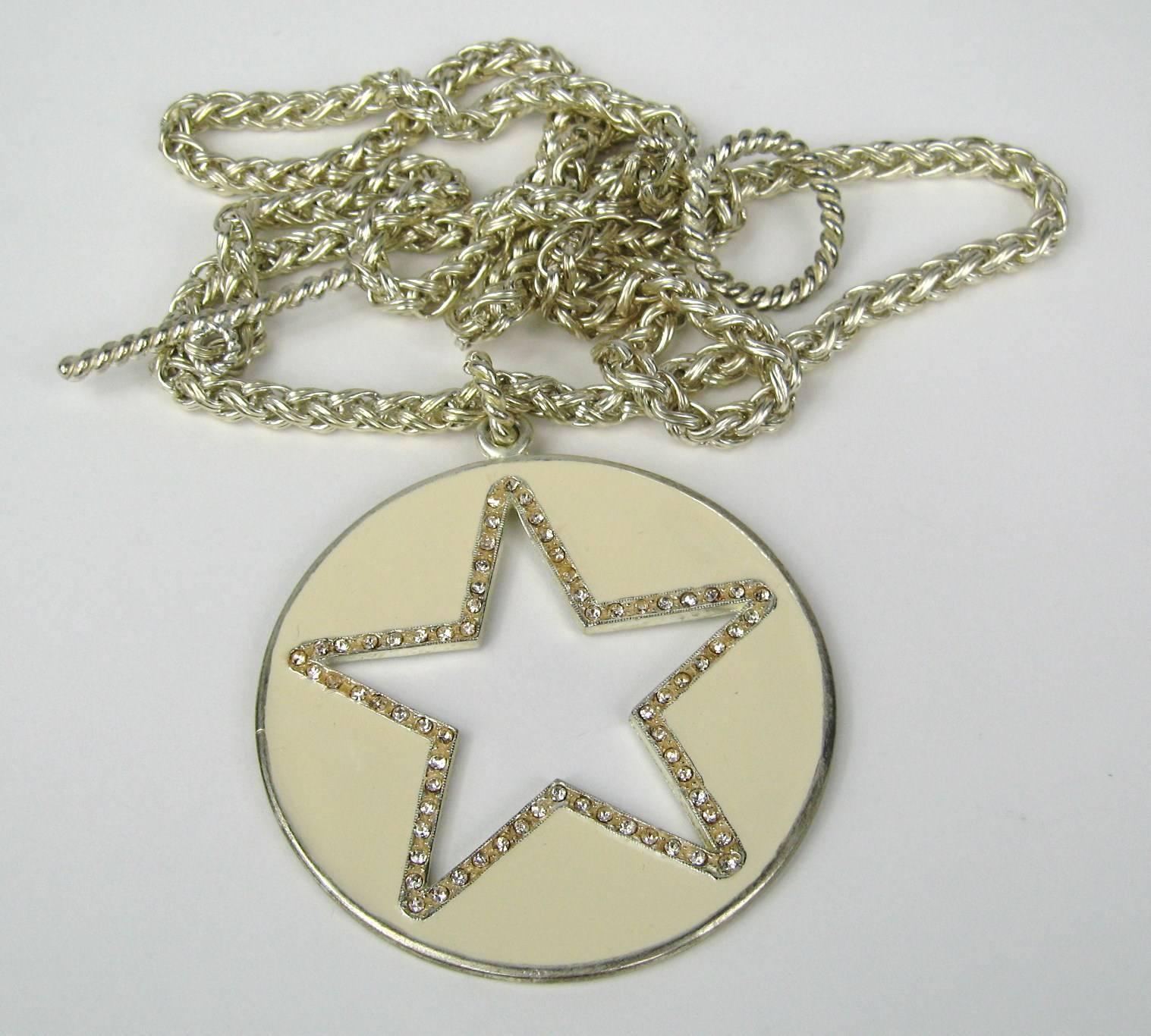 Cream colored enamel Star cut out with crystals surrounding the star. Long 43 in chain end to end Star pendant measures 2.85 in diameter. This is out of a massive collection of Hopi, Zuni, Navajo, Southwestern, sterling silver, costume jewelry and
