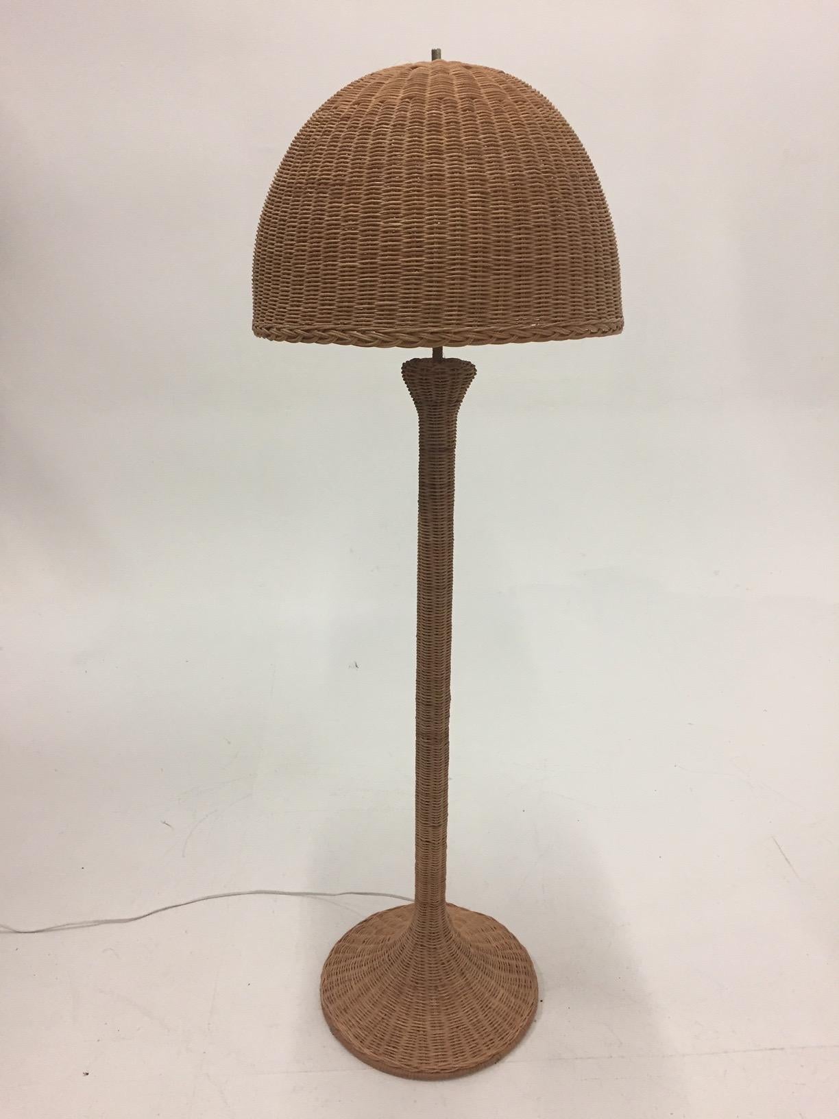 Great on a sun porch or in a beach house, a beautiful vintage wicker floor lamp with fabulous shade.
Measures: Shade 20.5 diameter, 15 height.
