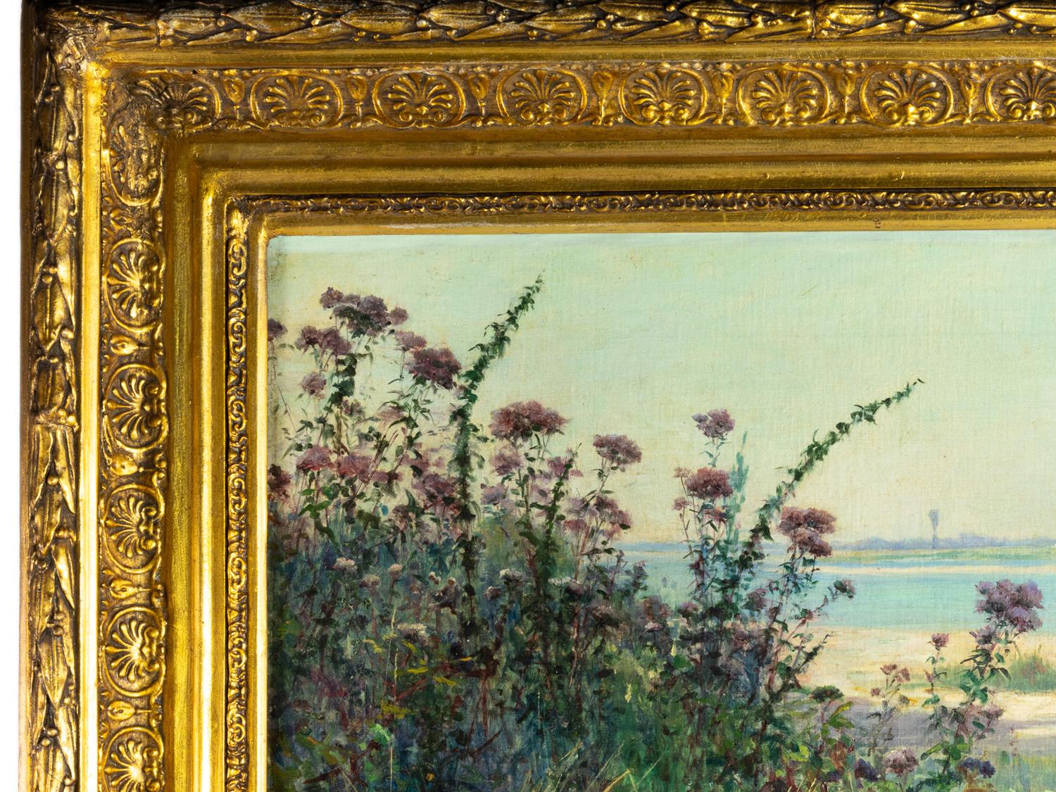 A 19th Century river shore oil painting, transitioning from the a Barbizon School to the Impressionist Style, with wild flowers and sand in a low angle.  A well conserved painting by Auguste Michel Nobillet of the style of Emile Louis Vernier, his