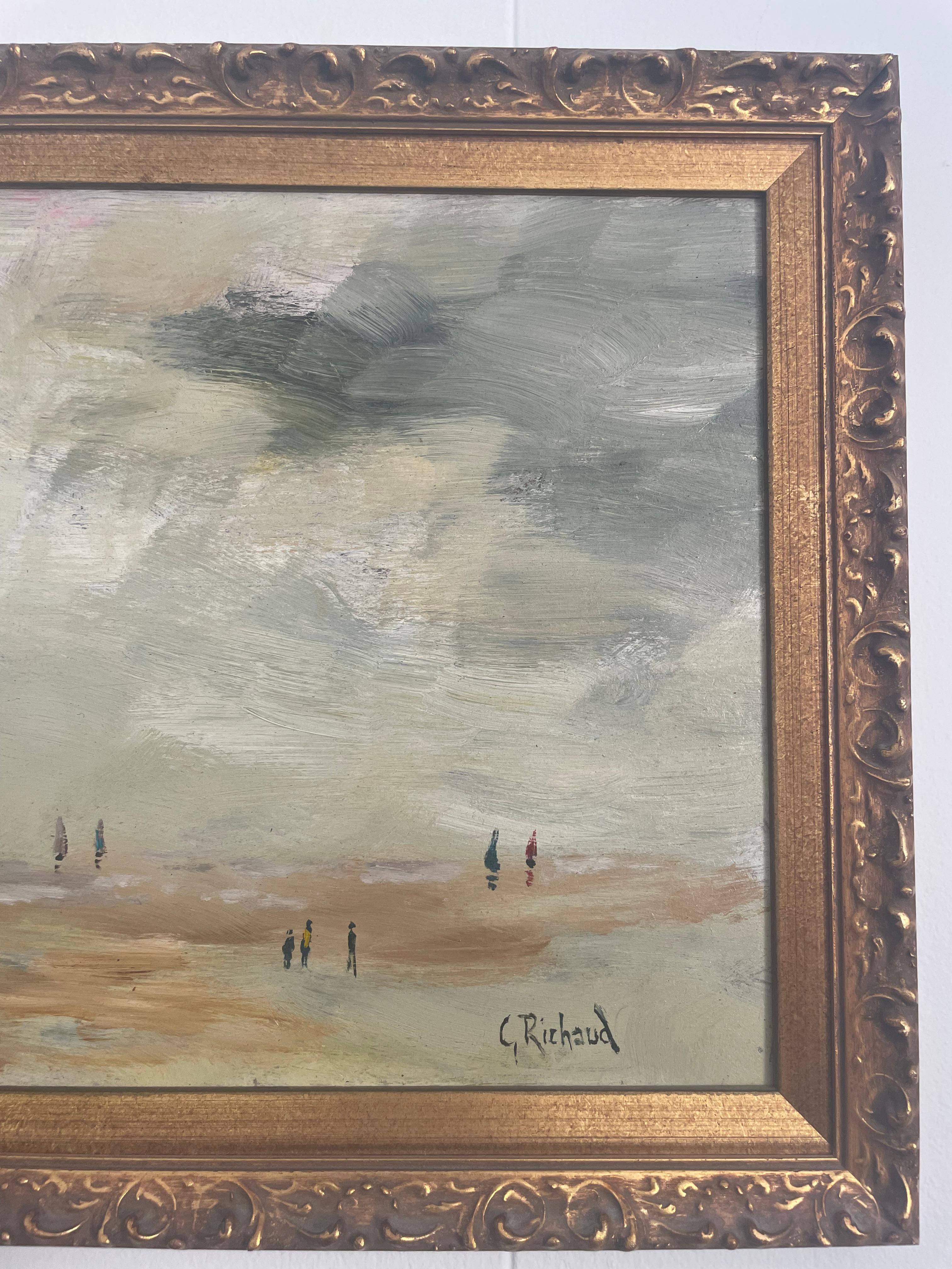 Oil on canvas signed by the French artist Georges Richaud. 
Painting depicts people on a beach shore, with a French flag waving from the breeze. 
G.Richaud is an accredited 20th-century French artist who was exhibited in France and England.
 