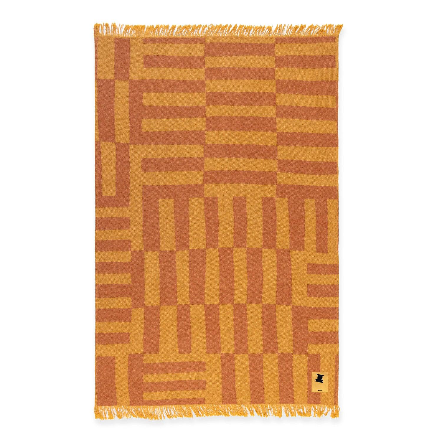 Woven from soft cotton jacquard in mustard and wine hues, this abstract multi-striped towel is made for slow summer days. Available in two sizes—one for quiet solo lounging, the other spacious enough to share with a friend, a partner, or little one.