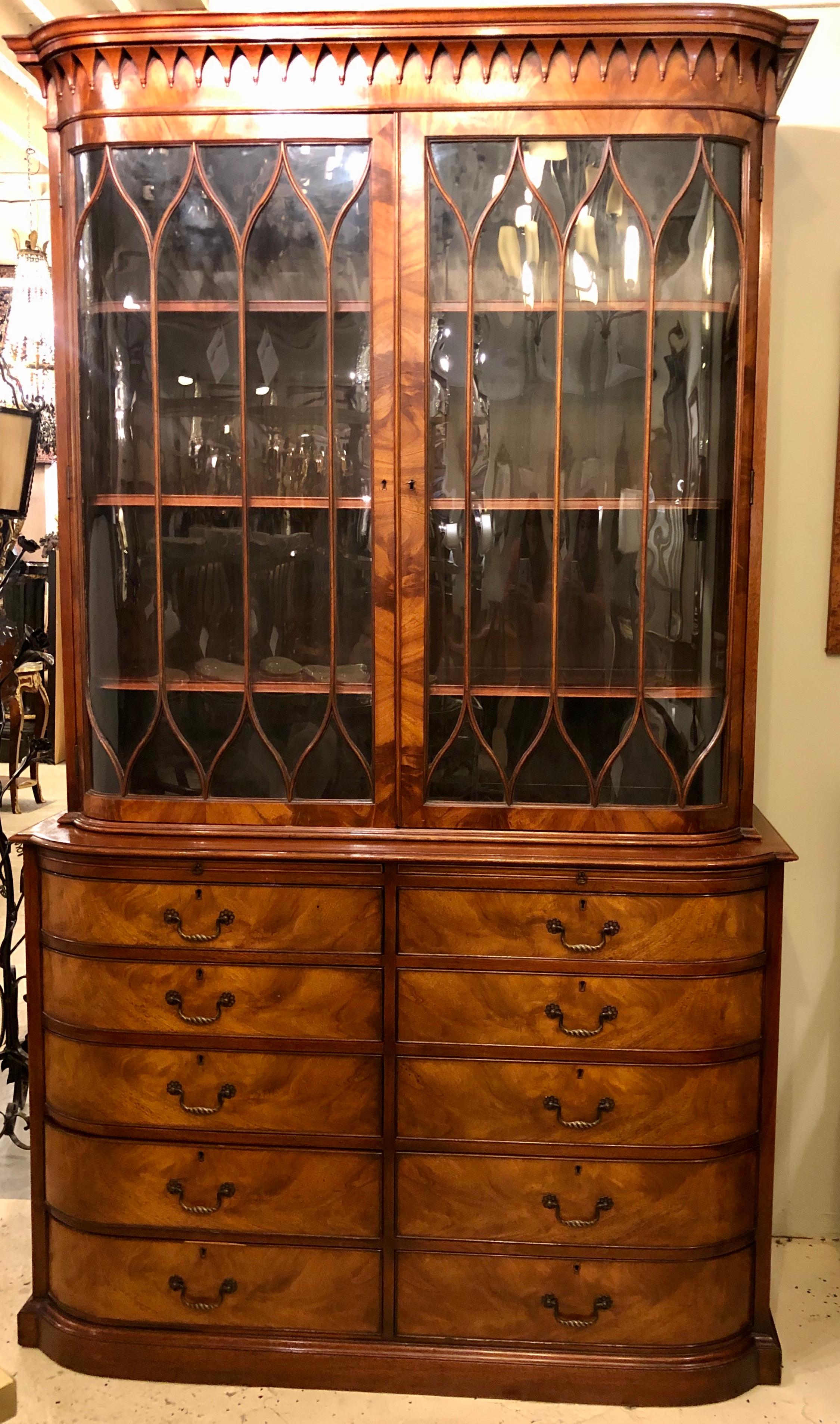 A Beacon Hill collection cabinet / breakfront or bookcase flame mahogany in the Georgian Style. A seemingly timeless piece from the 1930s made by this highly sought after cabinet maker comes this breakfront or cupboard cabinet with a double door