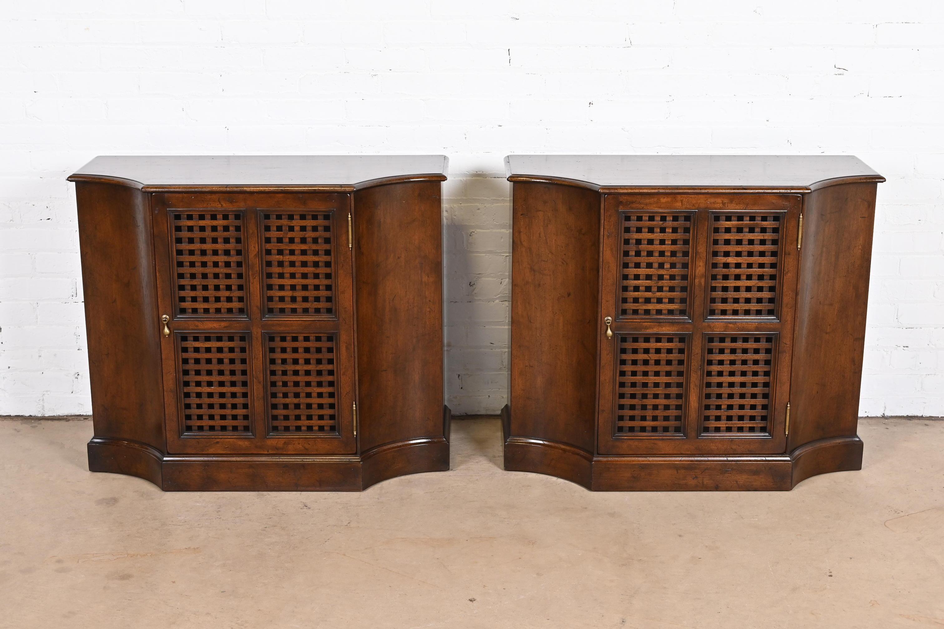 A gorgeous pair of Regency style commodes, consoles, or bedside tables

By Beacon Hill

USA, Mid-20th Century

Carved walnut, with lattice door fronts and original brass hardware.

Measures: 36