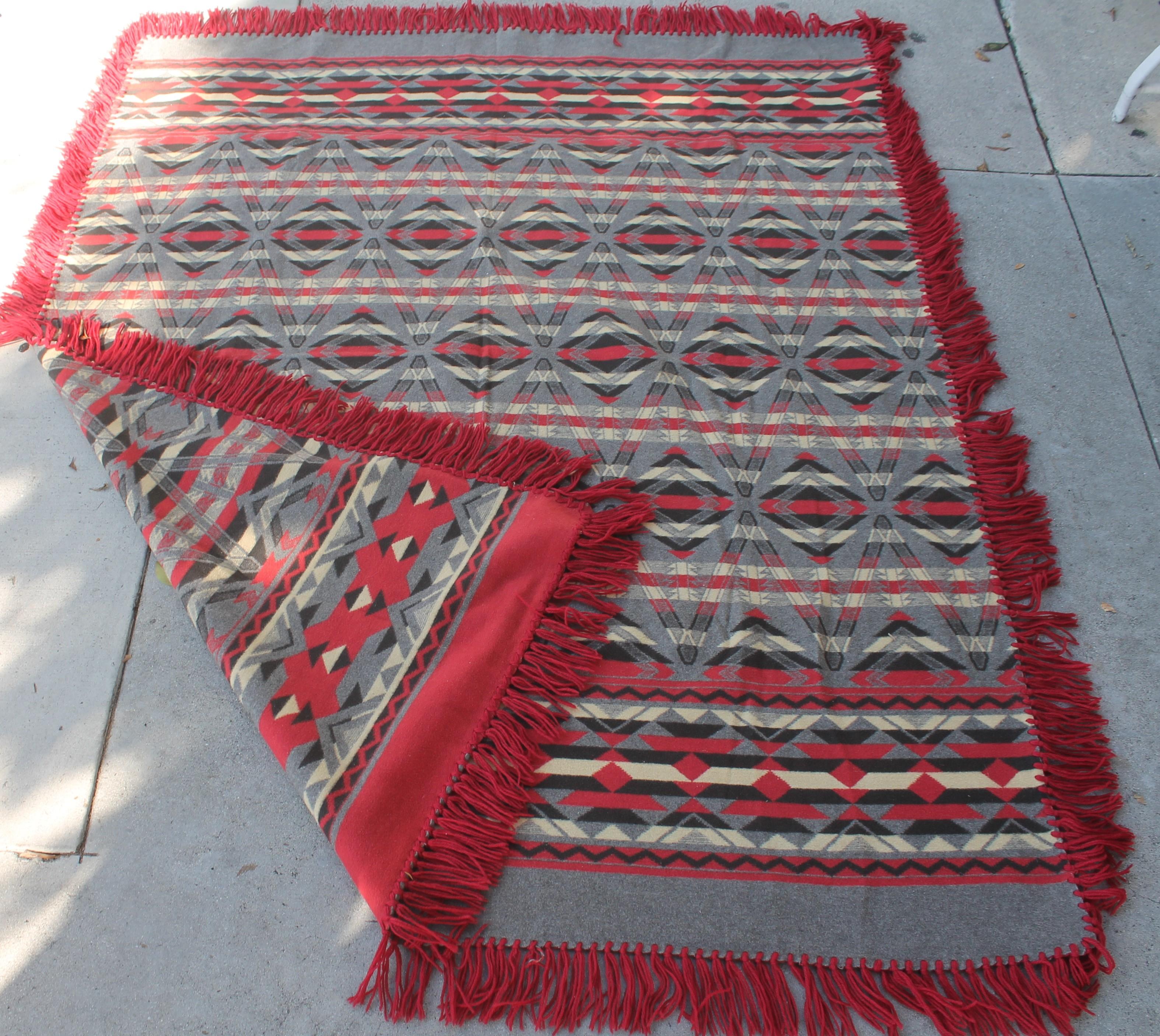 This early Beacon cotton Indian design camp blanket is in pristine condition. This was from a private collection and was never used. It retains the original fringe.