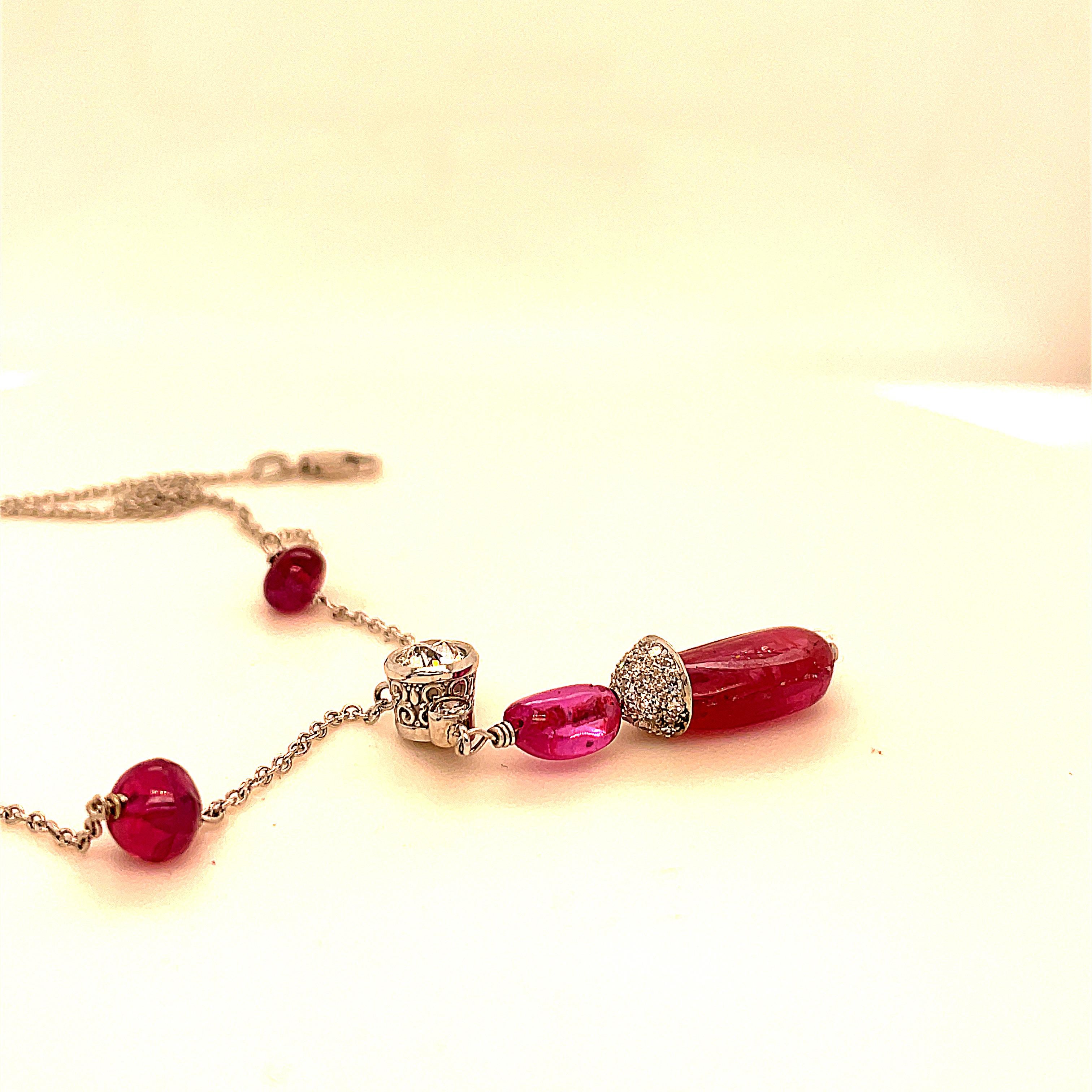 Edwardian style ruby and diamond platinum /white gold necklace.  Old European-cut diamonds, with lovely pigeon blood red rubies,  make a spectacular happy looking piece of jewelry. All the stones were mined and cut a long time ago. The stone quality