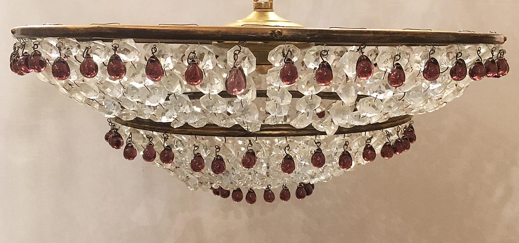 A circa 1930s French beaded crystal flush mount fixture with amethyst drops and interior candelabra lights.