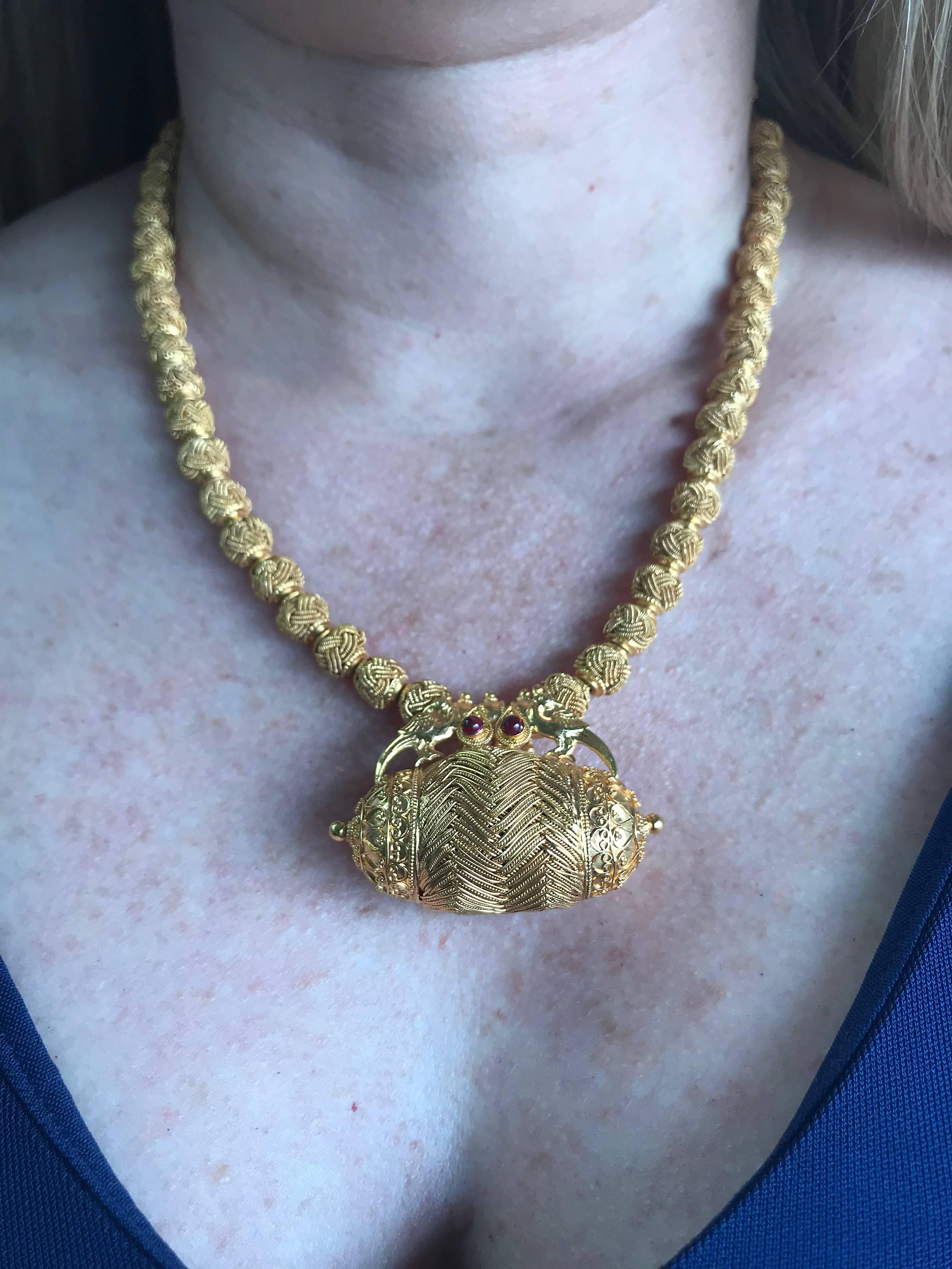 Modern Beaded Amulet and Birds 22 Karat Yellow Gold Necklace