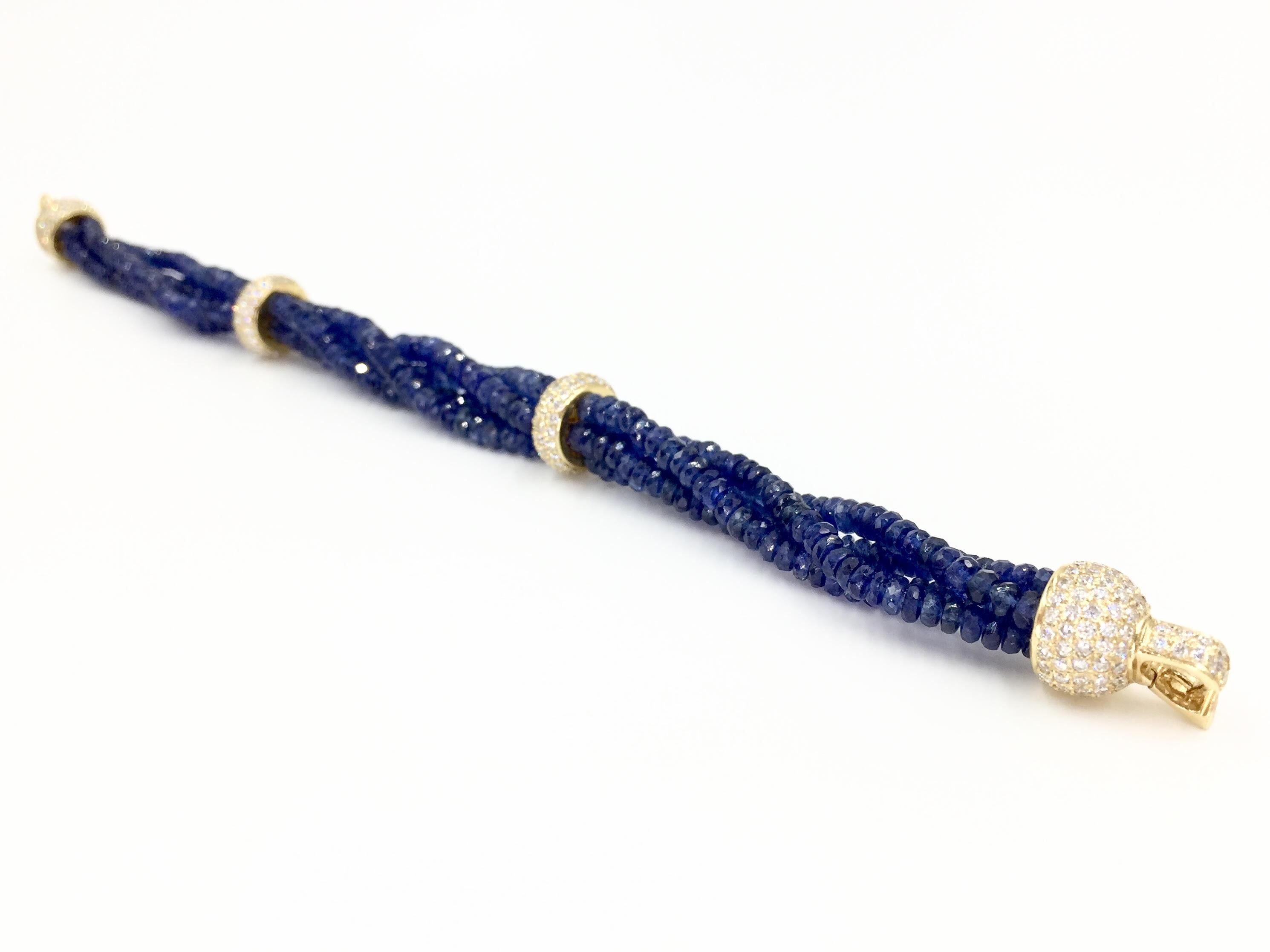 92.10 carats of sparkling genuine blue sapphire beads are expertly strung on this unique four strand bracelet. Two stationary separators and the clasp are pavé set with a total of 2.79 carats of high quality diamonds (approximately G color, VS