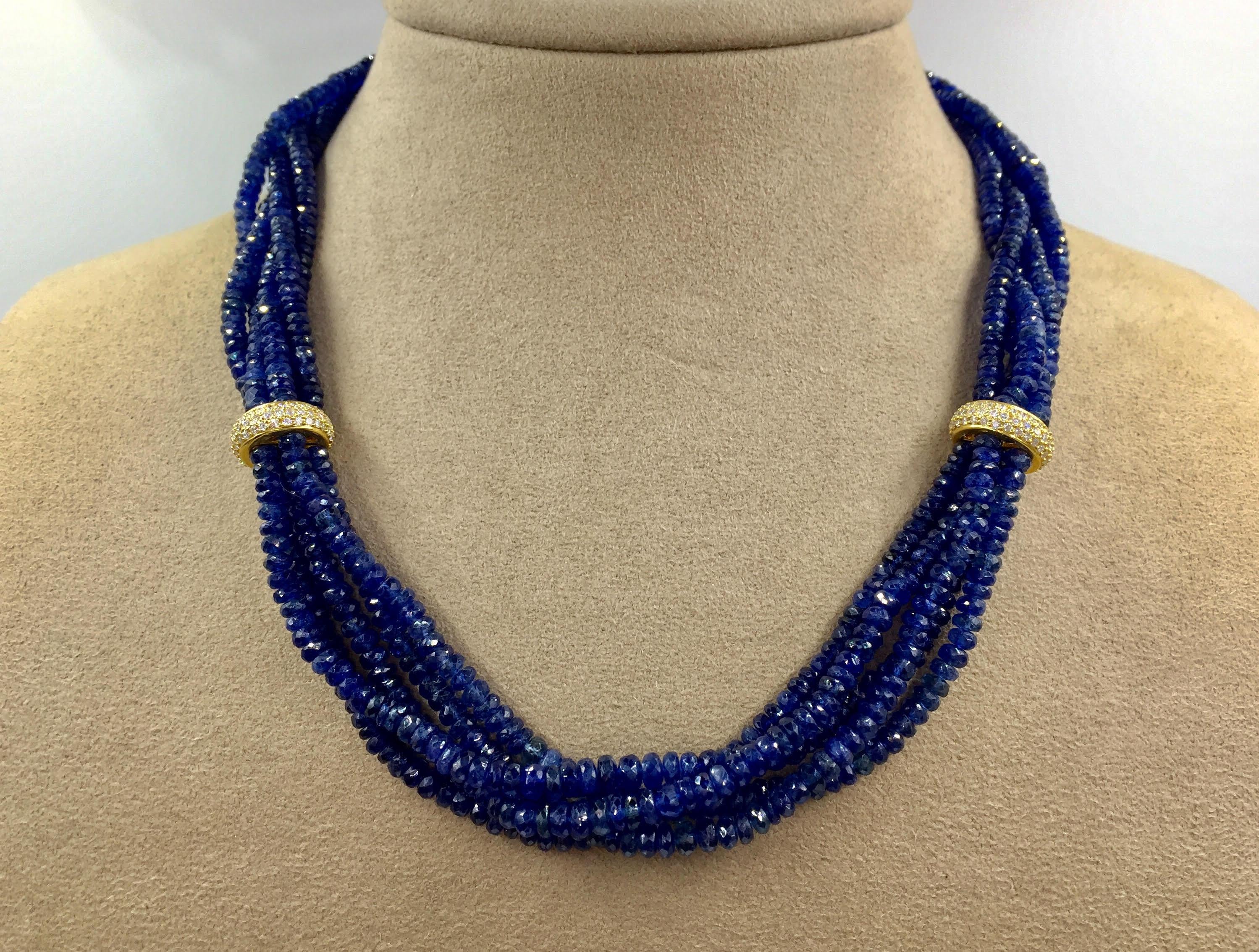 394.16 carats of sparkling genuine blue sapphire beads are expertly strung on this unique five strand necklace. Two stationary separators and the clasp are pavé set with a total of 3.16 carats of high quality diamonds (approximately G color, VS