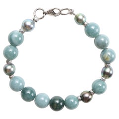 Bracelet en jade et perles de Tahiti, jadéite du Guatemala, fil et fermoir en titane