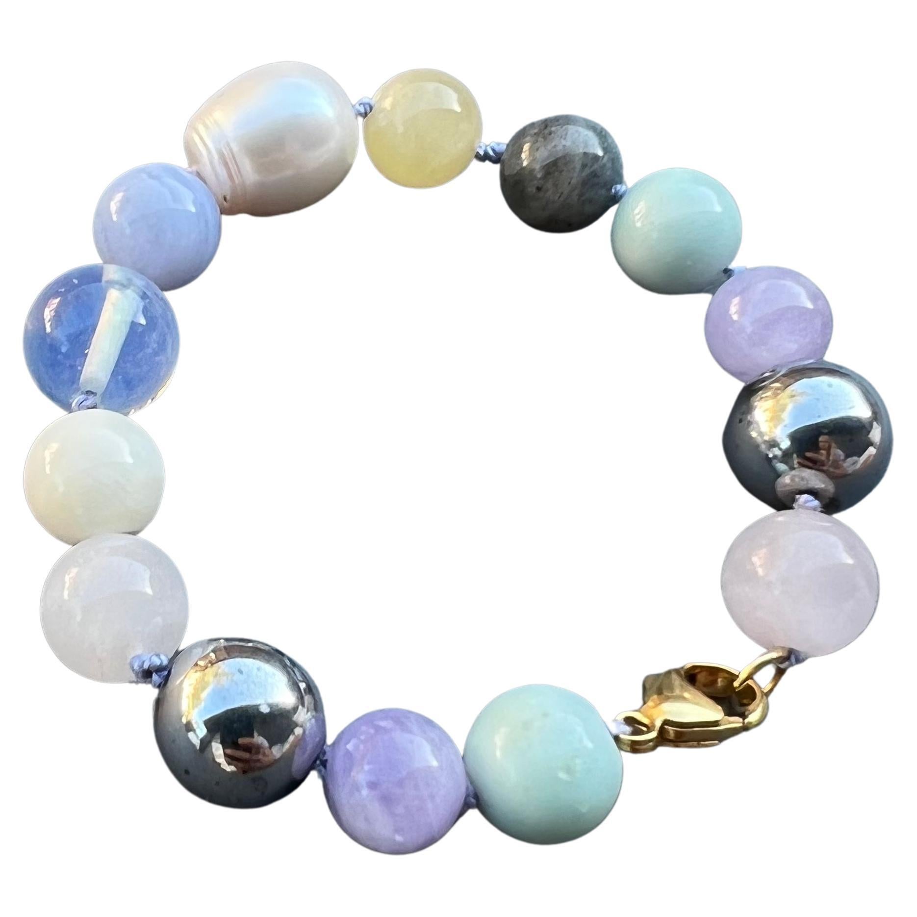 Bead Bracelet Multi color Multi Gem White Pearl 
Designer J Dauphin
Semi precious gems and Fresh water Pearl

Hand made in Los Angeles with Pastel Silk Threads
