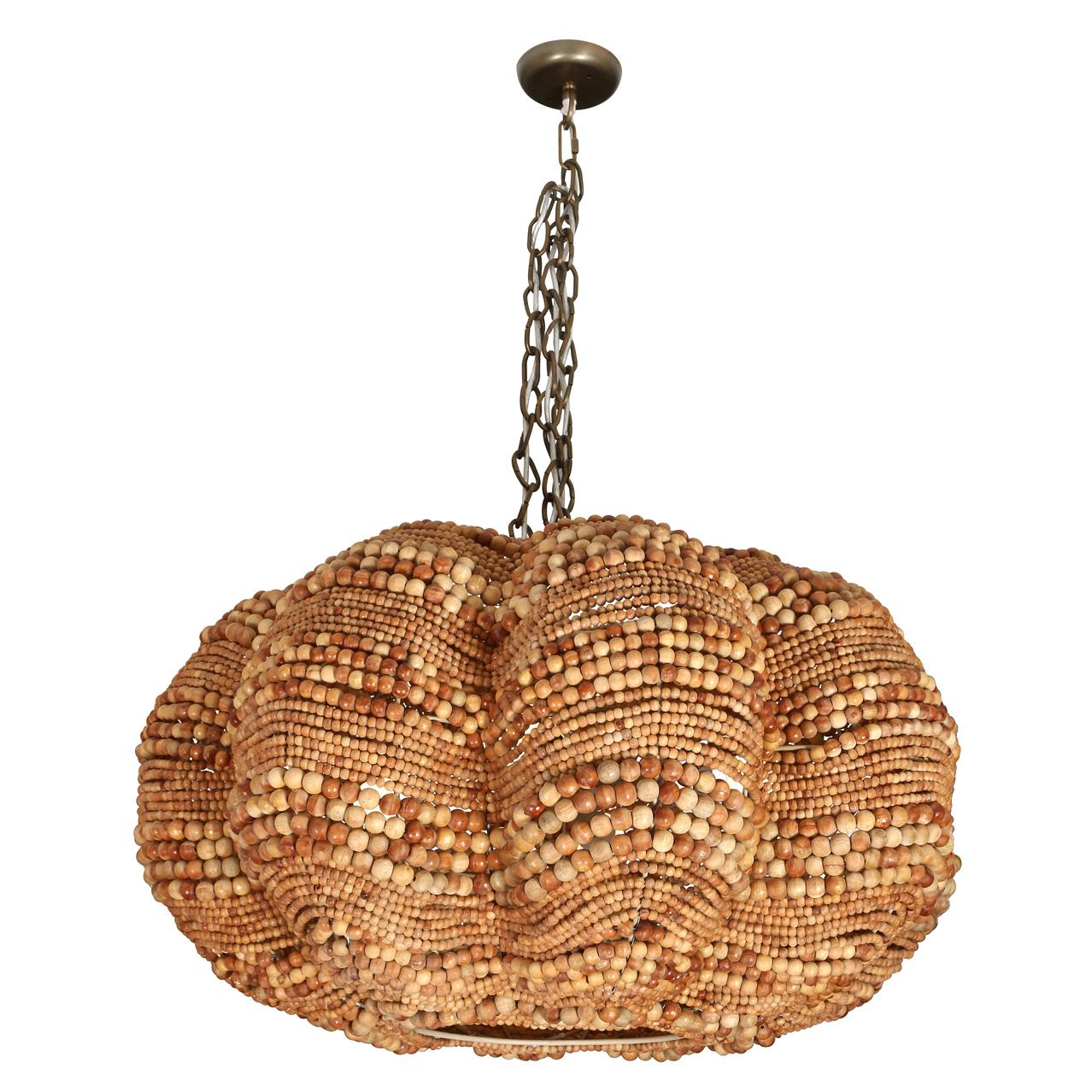 Add a splash of coastal charm and drama with our stunning Clamshell Chandelier! Crafted from wooden beads, this chandelier brings the serene beauty of the sea right into your space. Its unique clamshell shape casts a warm, inviting glow, turning any