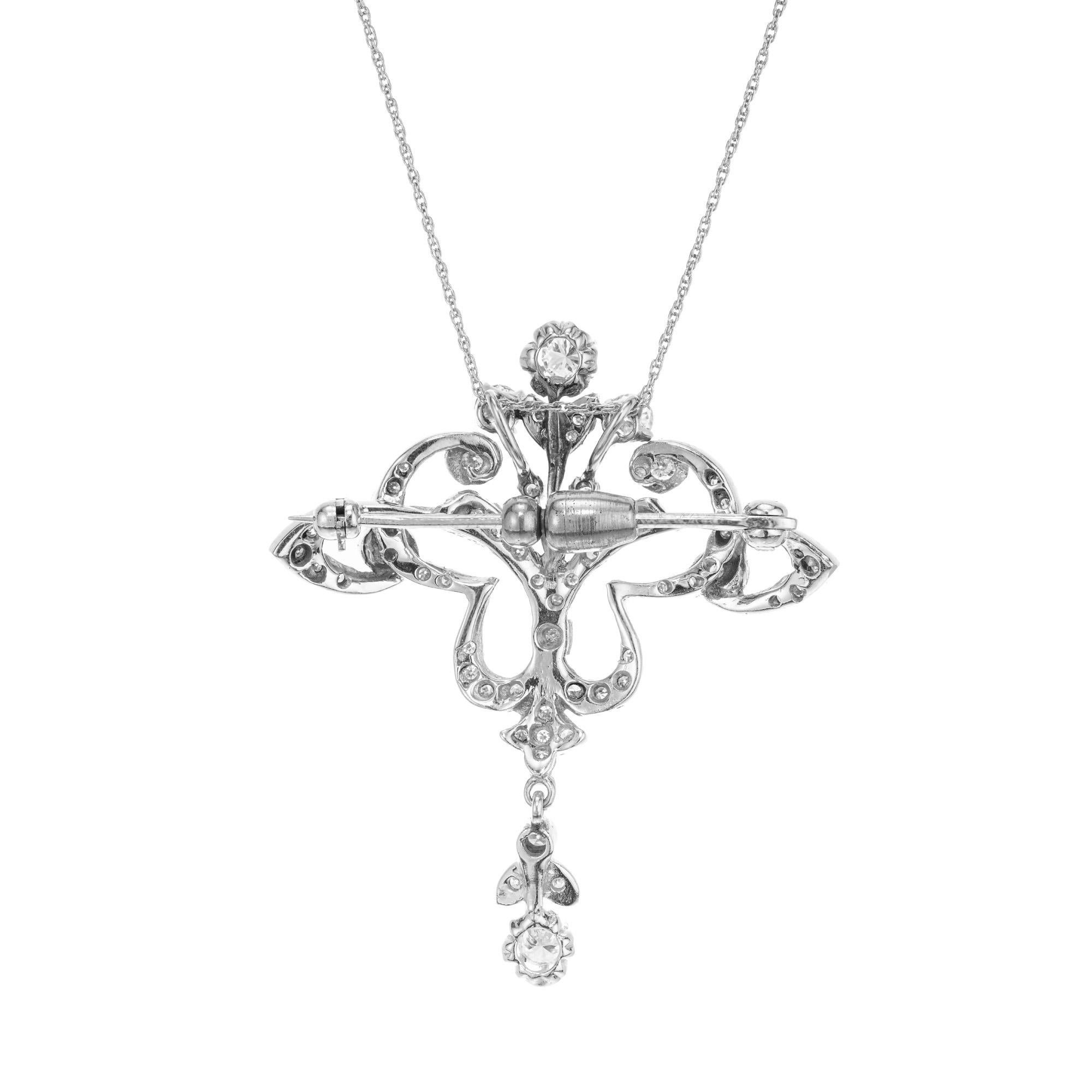 Stunning 1940's diamond pendant. Adorned with 58 round mixed diamonds. Can be worn at a pendant or a brooch. Constructed out of 14k white gold, this highly detailed and open work pendant is a perfect example of Art Deco era.  open work.

58 round