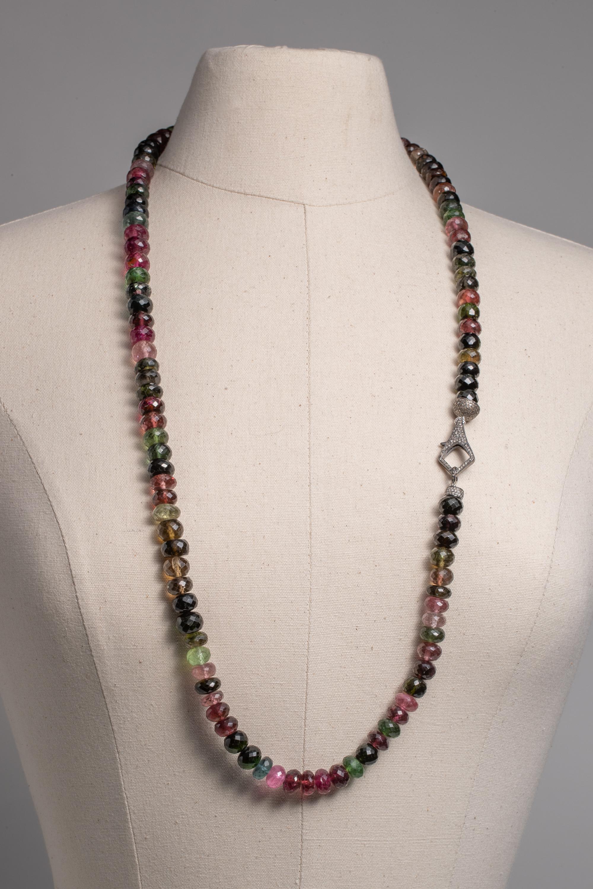 Wear long or double it up short, a multi-color, faceted 12mm tourmaline beaded necklace.  Features  pave`-set diamond end caps and a double-sided pave` diamond clasp which you can choose to display.  Lots of pink tourmaline in this piece.  36 inches
