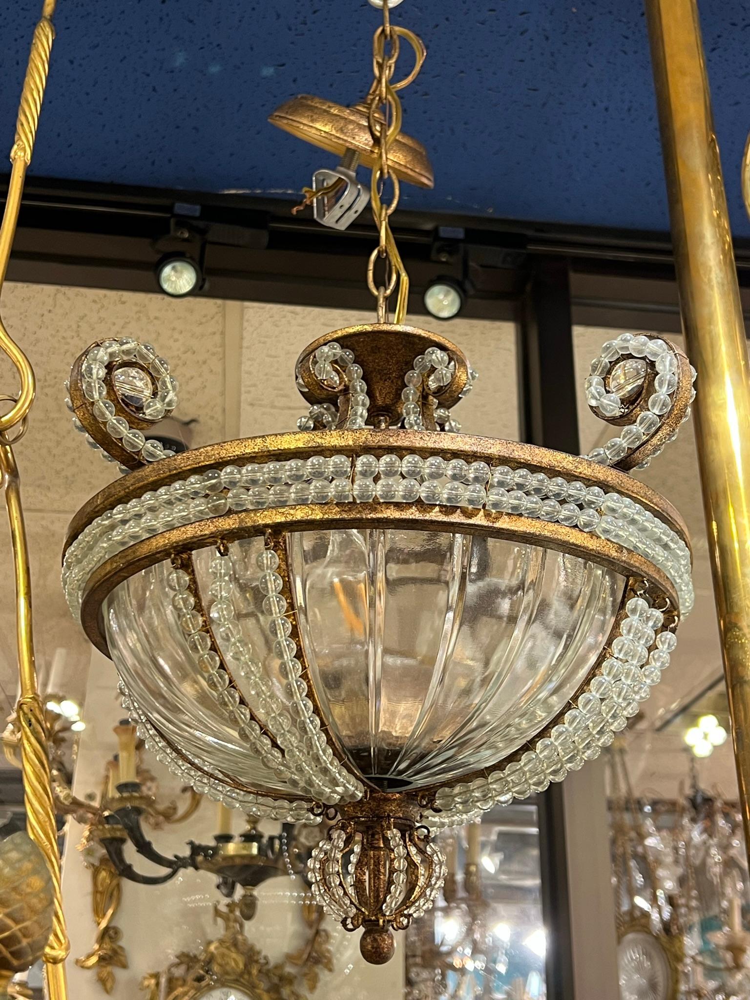 Beaded glass and bronze chandelier.