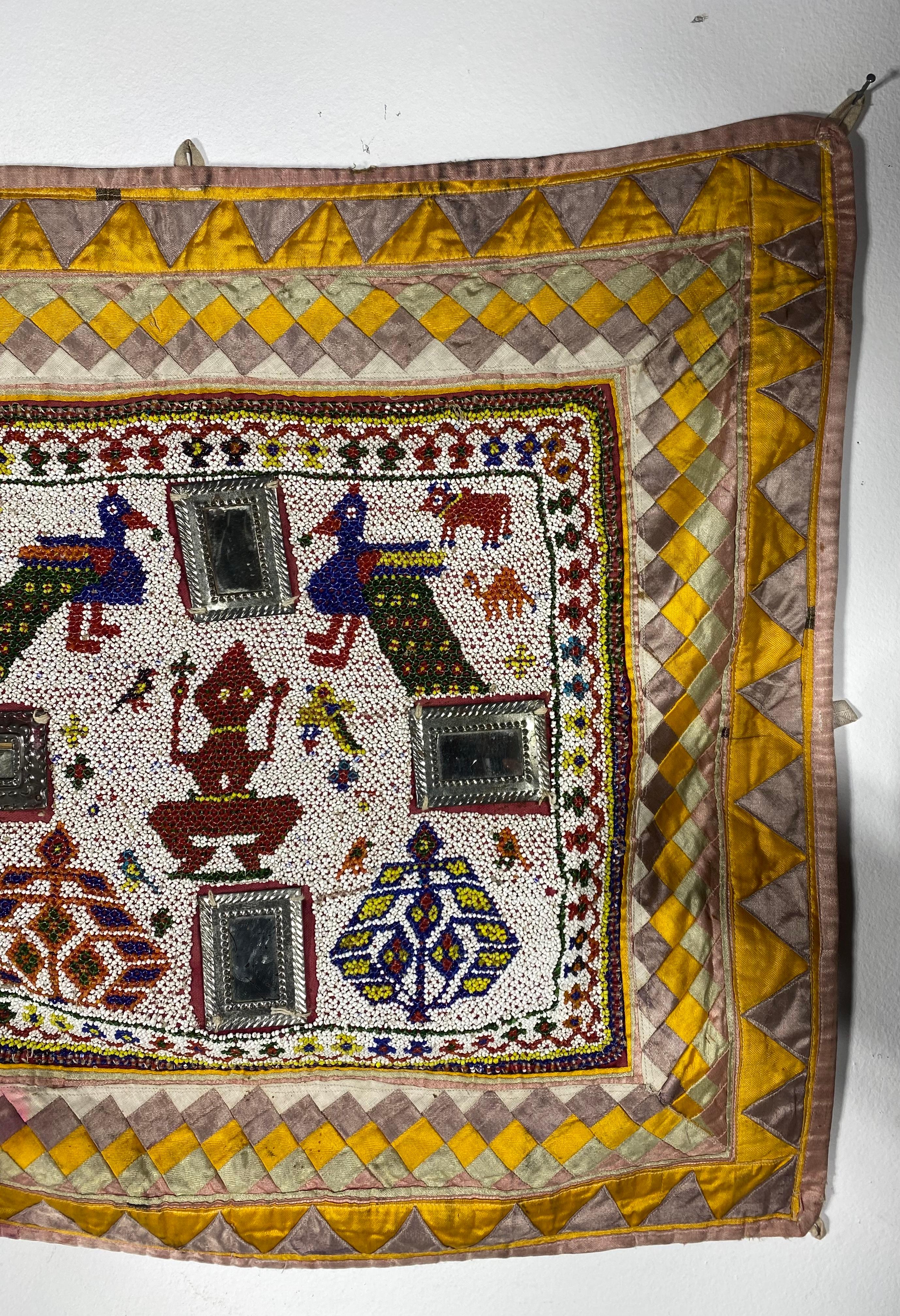 Beaded / Hand embroidered  Chakla Cloth Gujarat Saurashta Textile from India,, Wonderfully decorated.. Intricate bead work,, Unusual applied mirrors,, Some bleed through dis-coloration (see photo) This hand made and hand beaded textile is from