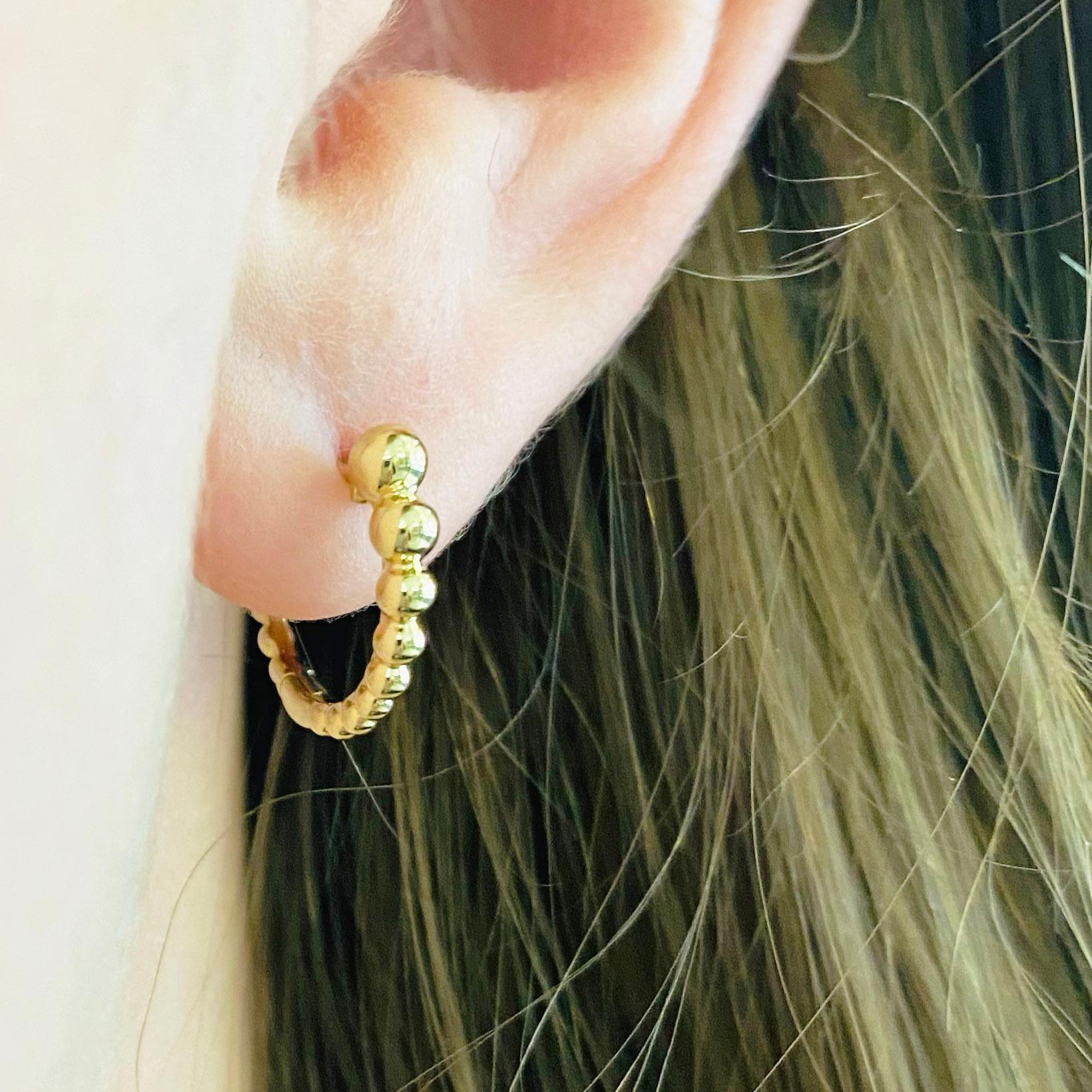 These stunning Gabriel & Co. 14k yellow gold beaded detailed huggie hoops provide a look that is both trendy and classic. These earrings are a great staple to add to your collection, and can be worn with both casual and formal wear.  These earrings